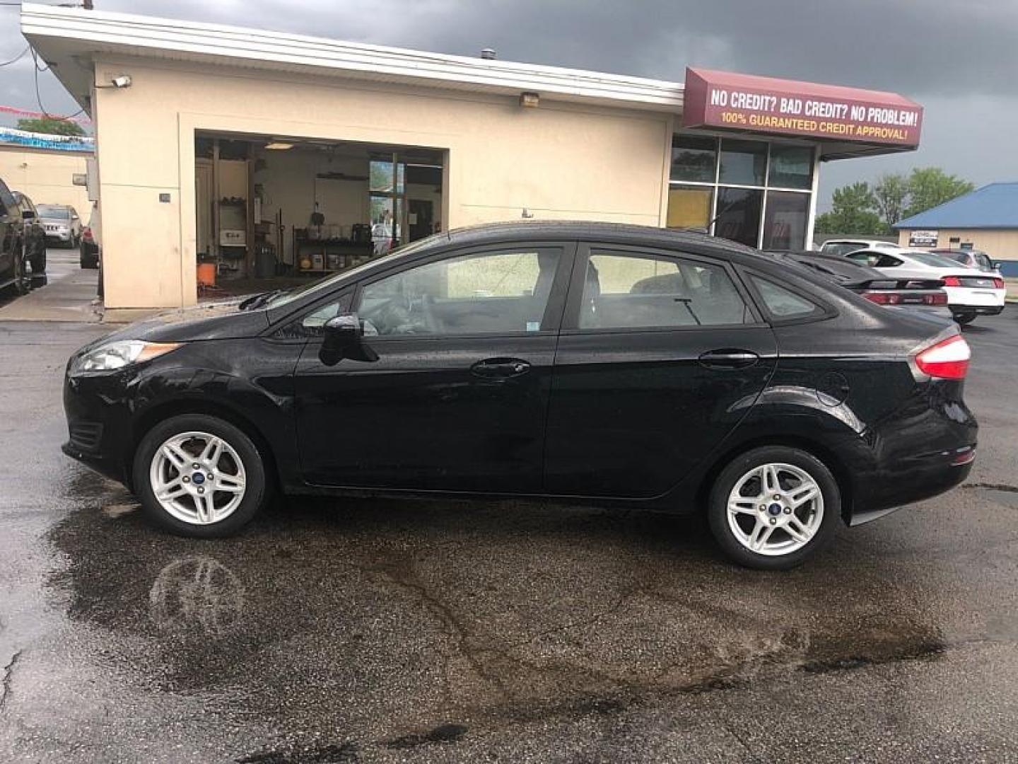 2019 BLACK /BLACK Ford Fiesta SE Sedan (3FADP4BJ4KM) with an 1.6L L4 DOHC 16V engine, Automatic transmission, located at 3304 Woodville Road, Northwood, OH, 43619, (419) 210-8019, 41.612694, -83.480743 - We are #1 Auto Loan Dealer for Good Bad or No Credit we have hundreds of vehicles to choose from, stop on in or just fill out our online application to get approved for auto financing and see your credit score for free by visiting our website today. We have Low Payment Options and Terms Available - Photo#1