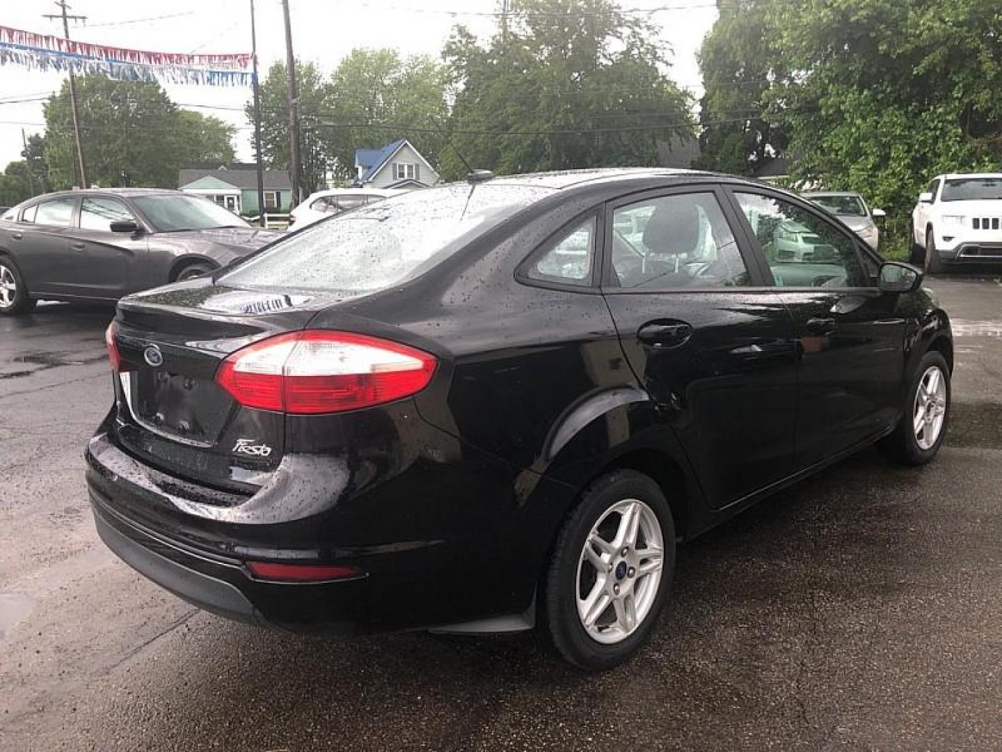 2019 BLACK /BLACK Ford Fiesta SE Sedan (3FADP4BJ4KM) with an 1.6L L4 DOHC 16V engine, Automatic transmission, located at 3304 Woodville Road, Northwood, OH, 43619, (419) 210-8019, 41.612694, -83.480743 - We are #1 Auto Loan Dealer for Good Bad or No Credit we have hundreds of vehicles to choose from, stop on in or just fill out our online application to get approved for auto financing and see your credit score for free by visiting our website today. We have Low Payment Options and Terms Available - Photo#4