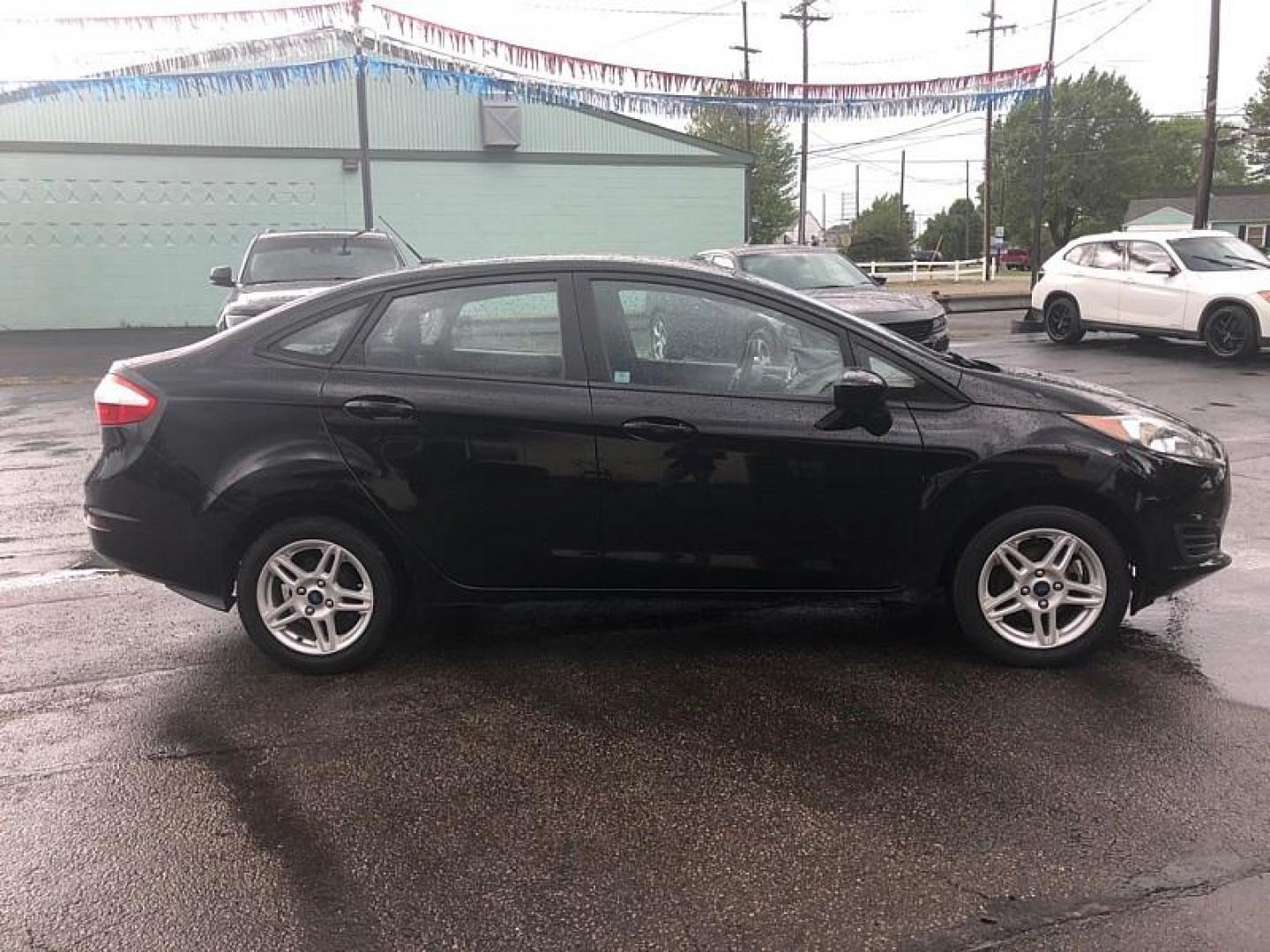 2019 BLACK /BLACK Ford Fiesta SE Sedan (3FADP4BJ4KM) with an 1.6L L4 DOHC 16V engine, Automatic transmission, located at 3304 Woodville Road, Northwood, OH, 43619, (419) 210-8019, 41.612694, -83.480743 - We are #1 Auto Loan Dealer for Good Bad or No Credit we have hundreds of vehicles to choose from, stop on in or just fill out our online application to get approved for auto financing and see your credit score for free by visiting our website today. We have Low Payment Options and Terms Available - Photo#5