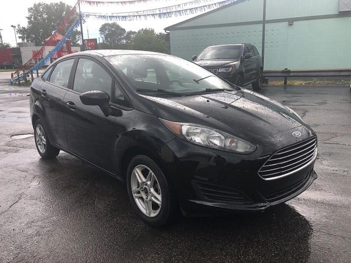 2019 BLACK /BLACK Ford Fiesta SE Sedan (3FADP4BJ4KM) with an 1.6L L4 DOHC 16V engine, Automatic transmission, located at 3304 Woodville Road, Northwood, OH, 43619, (419) 210-8019, 41.612694, -83.480743 - We are #1 Auto Loan Dealer for Good Bad or No Credit we have hundreds of vehicles to choose from, stop on in or just fill out our online application to get approved for auto financing and see your credit score for free by visiting our website today. We have Low Payment Options and Terms Available - Photo#6