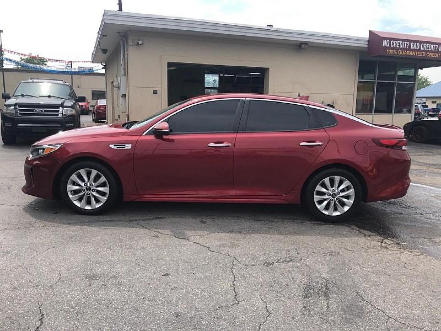 2018 RED /BLACK Kia Optima LX (5XXGT4L30JG) with an 2.4L L4 DOHC 16V engine, 6A transmission, located at 3304 Woodville Road, Northwood, OH, 43619, (419) 210-8019, 41.612694, -83.480743 - Photo#1