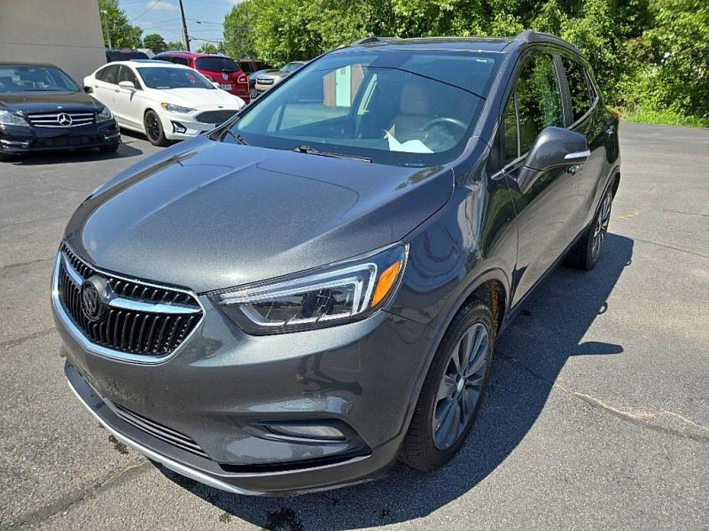 2017 GRAY /BROWN Buick Encore Essence FWD (KL4CJCSB1HB) with an 1.4L L4 DOHC 16V TURBO engine, 6A transmission, located at 3304 Woodville Road, Northwood, OH, 43619, (419) 210-8019, 41.612694, -83.480743 - Photo#0