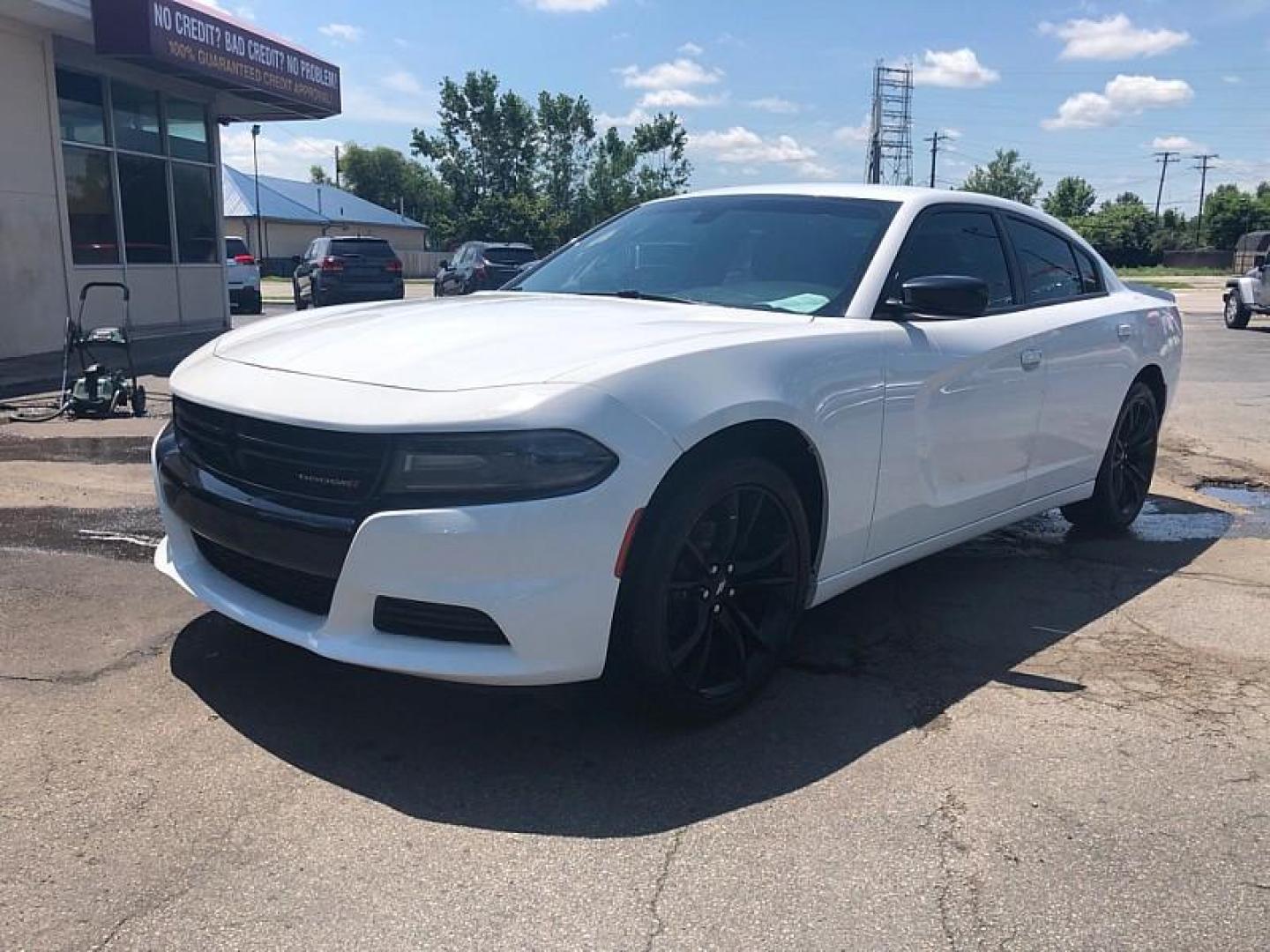 2018 WHITE /BLACK Dodge Charger SE (2C3CDXBG3JH) with an 3.6L V6 DOHC 24V engine, 8A transmission, located at 3304 Woodville Road, Northwood, OH, 43619, (419) 210-8019, 41.612694, -83.480743 - We are #1 Auto Loan Dealer for Good Bad or No Credit we have hundreds of vehicles to choose from, stop on in or just fill out our online application to get approved for auto financing and see your credit score for free by visiting our website today. We have Low Payment Options and Terms Available - Photo#0