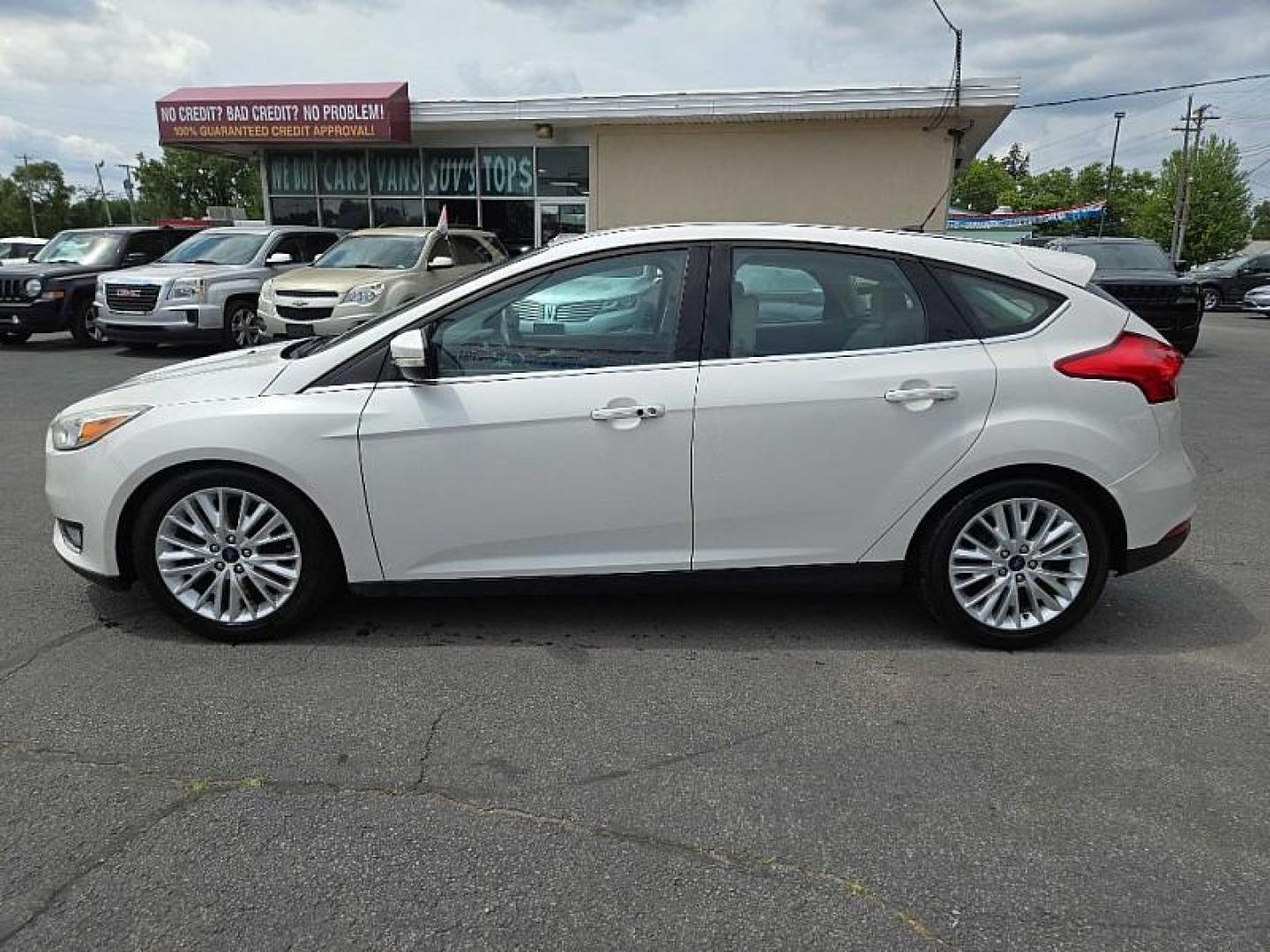 2016 WHITE /TAN Ford Focus Titanium Hatch (1FADP3N21GL) with an 2.0L L4 DOHC 16V engine, 6A transmission, located at 3304 Woodville Road, Northwood, OH, 43619, (419) 210-8019, 41.612694, -83.480743 - We are #1 Auto Loan Dealer for Good Bad or No Credit we have hundreds of vehicles to choose from, stop on in or just fill out our online application to get approved for auto financing and see your credit score for free by visiting our website today. We have Low Payment Options and Terms Available - Photo#1