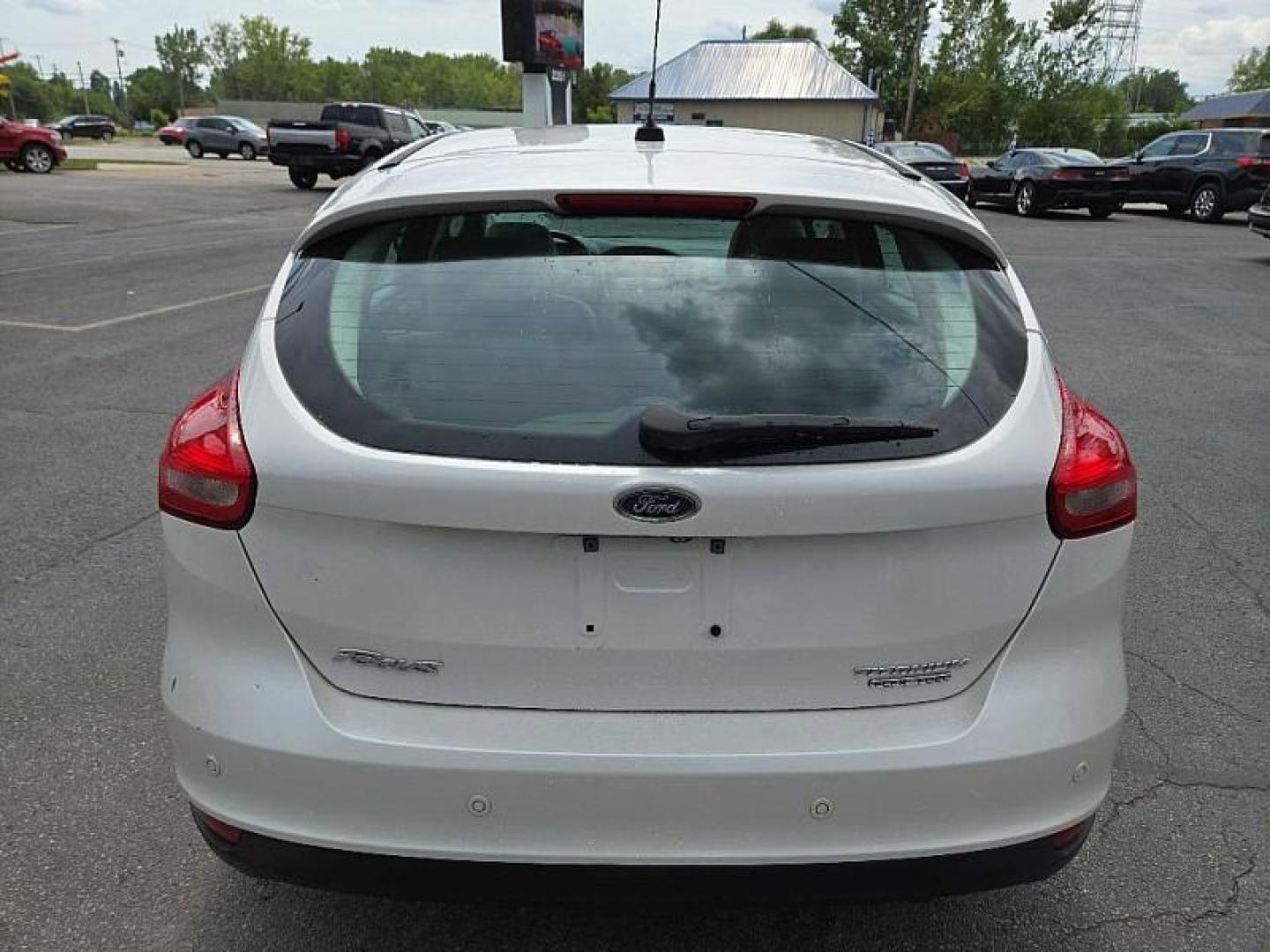 2016 WHITE /TAN Ford Focus Titanium Hatch (1FADP3N21GL) with an 2.0L L4 DOHC 16V engine, 6A transmission, located at 3304 Woodville Road, Northwood, OH, 43619, (419) 210-8019, 41.612694, -83.480743 - We are #1 Auto Loan Dealer for Good Bad or No Credit we have hundreds of vehicles to choose from, stop on in or just fill out our online application to get approved for auto financing and see your credit score for free by visiting our website today. We have Low Payment Options and Terms Available - Photo#3