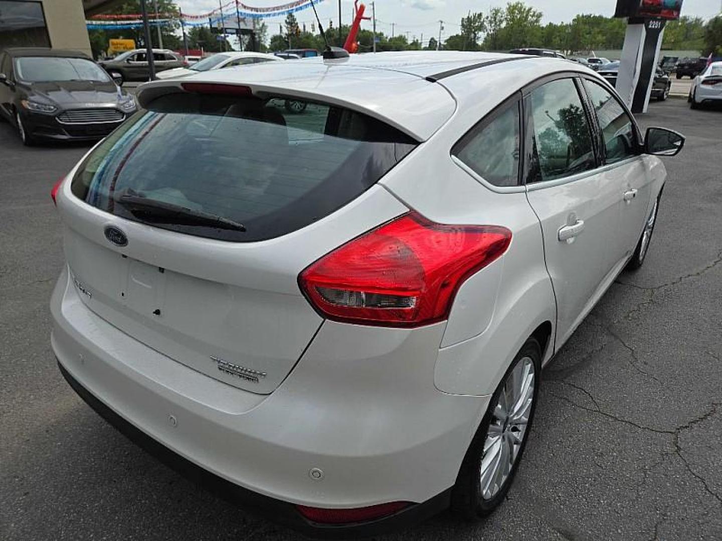 2016 WHITE /TAN Ford Focus Titanium Hatch (1FADP3N21GL) with an 2.0L L4 DOHC 16V engine, 6A transmission, located at 3304 Woodville Road, Northwood, OH, 43619, (419) 210-8019, 41.612694, -83.480743 - We are #1 Auto Loan Dealer for Good Bad or No Credit we have hundreds of vehicles to choose from, stop on in or just fill out our online application to get approved for auto financing and see your credit score for free by visiting our website today. We have Low Payment Options and Terms Available - Photo#4