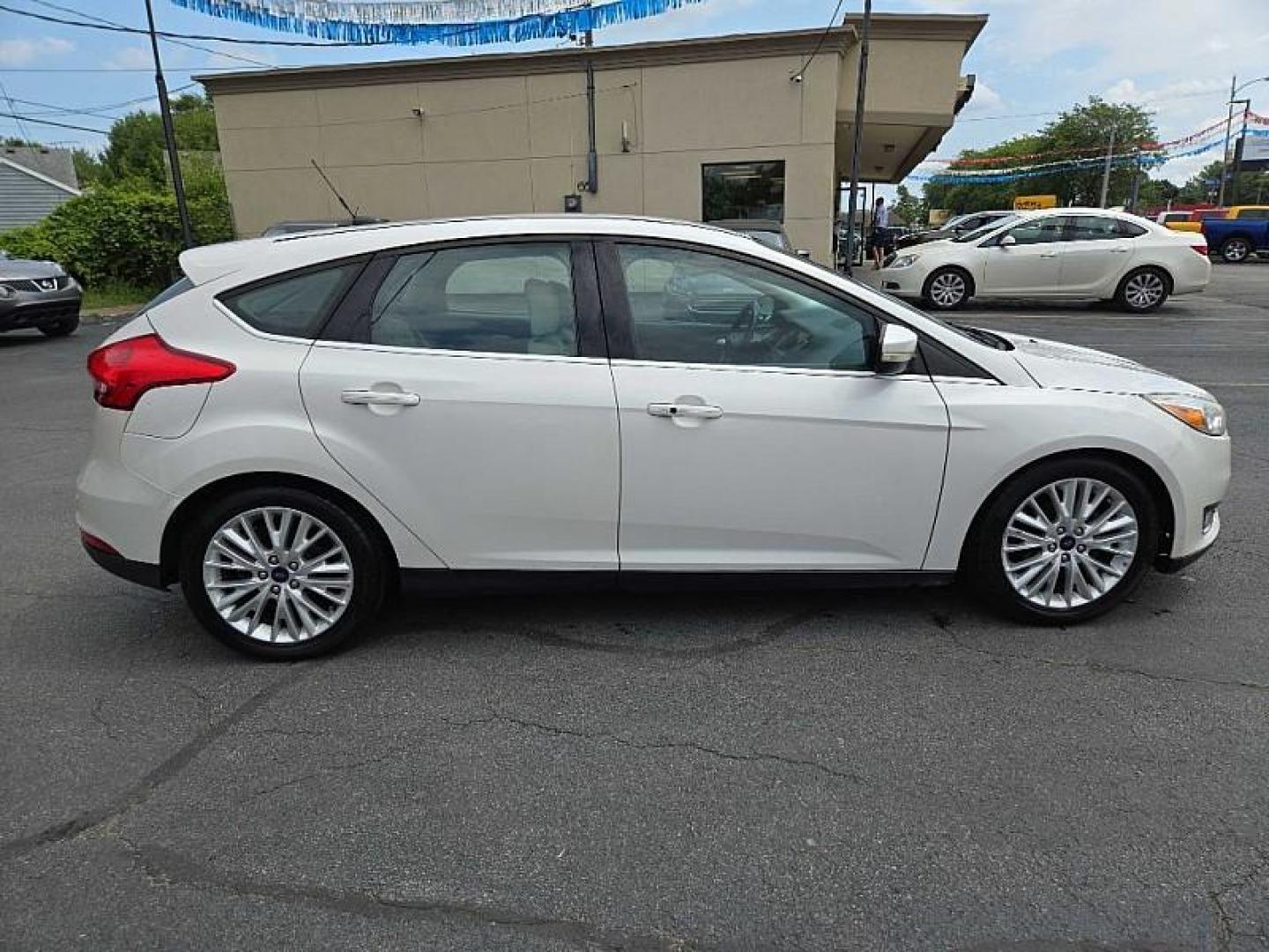 2016 WHITE /TAN Ford Focus Titanium Hatch (1FADP3N21GL) with an 2.0L L4 DOHC 16V engine, 6A transmission, located at 3304 Woodville Road, Northwood, OH, 43619, (419) 210-8019, 41.612694, -83.480743 - We are #1 Auto Loan Dealer for Good Bad or No Credit we have hundreds of vehicles to choose from, stop on in or just fill out our online application to get approved for auto financing and see your credit score for free by visiting our website today. We have Low Payment Options and Terms Available - Photo#5