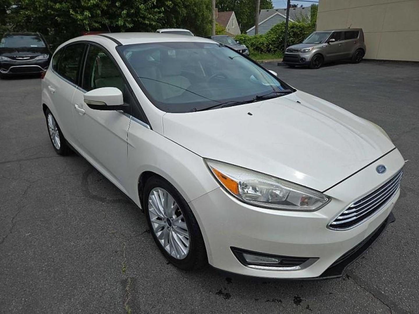 2016 WHITE /TAN Ford Focus Titanium Hatch (1FADP3N21GL) with an 2.0L L4 DOHC 16V engine, 6A transmission, located at 3304 Woodville Road, Northwood, OH, 43619, (419) 210-8019, 41.612694, -83.480743 - We are #1 Auto Loan Dealer for Good Bad or No Credit we have hundreds of vehicles to choose from, stop on in or just fill out our online application to get approved for auto financing and see your credit score for free by visiting our website today. We have Low Payment Options and Terms Available - Photo#6