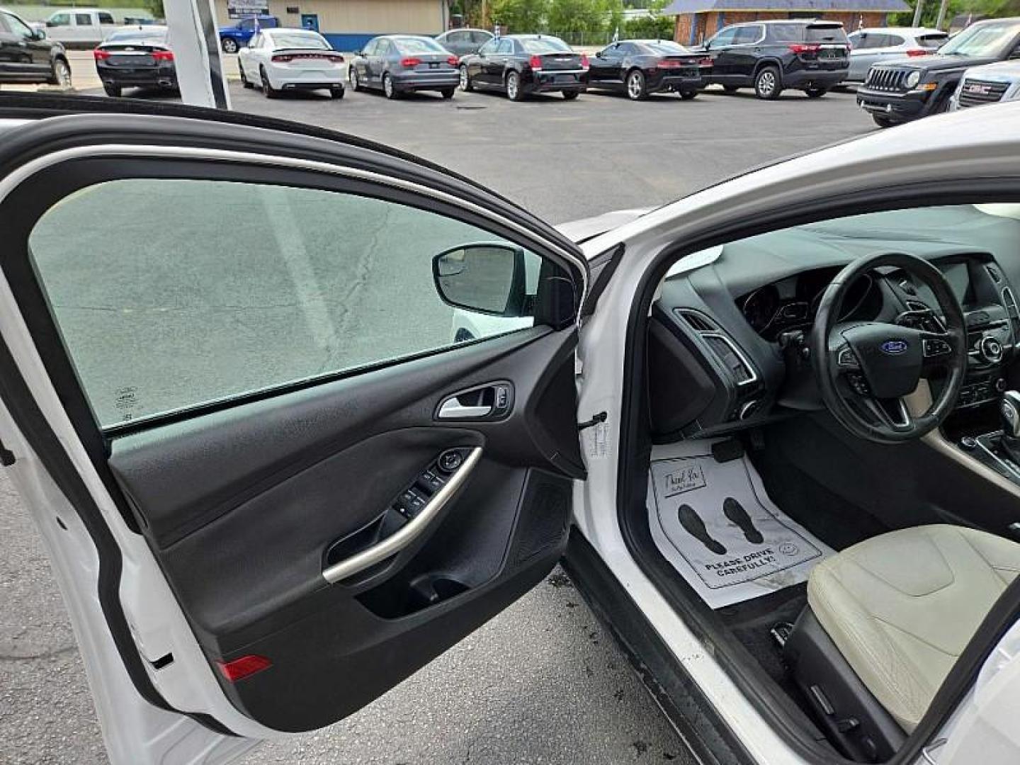 2016 WHITE /TAN Ford Focus Titanium Hatch (1FADP3N21GL) with an 2.0L L4 DOHC 16V engine, 6A transmission, located at 3304 Woodville Road, Northwood, OH, 43619, (419) 210-8019, 41.612694, -83.480743 - We are #1 Auto Loan Dealer for Good Bad or No Credit we have hundreds of vehicles to choose from, stop on in or just fill out our online application to get approved for auto financing and see your credit score for free by visiting our website today. We have Low Payment Options and Terms Available - Photo#8