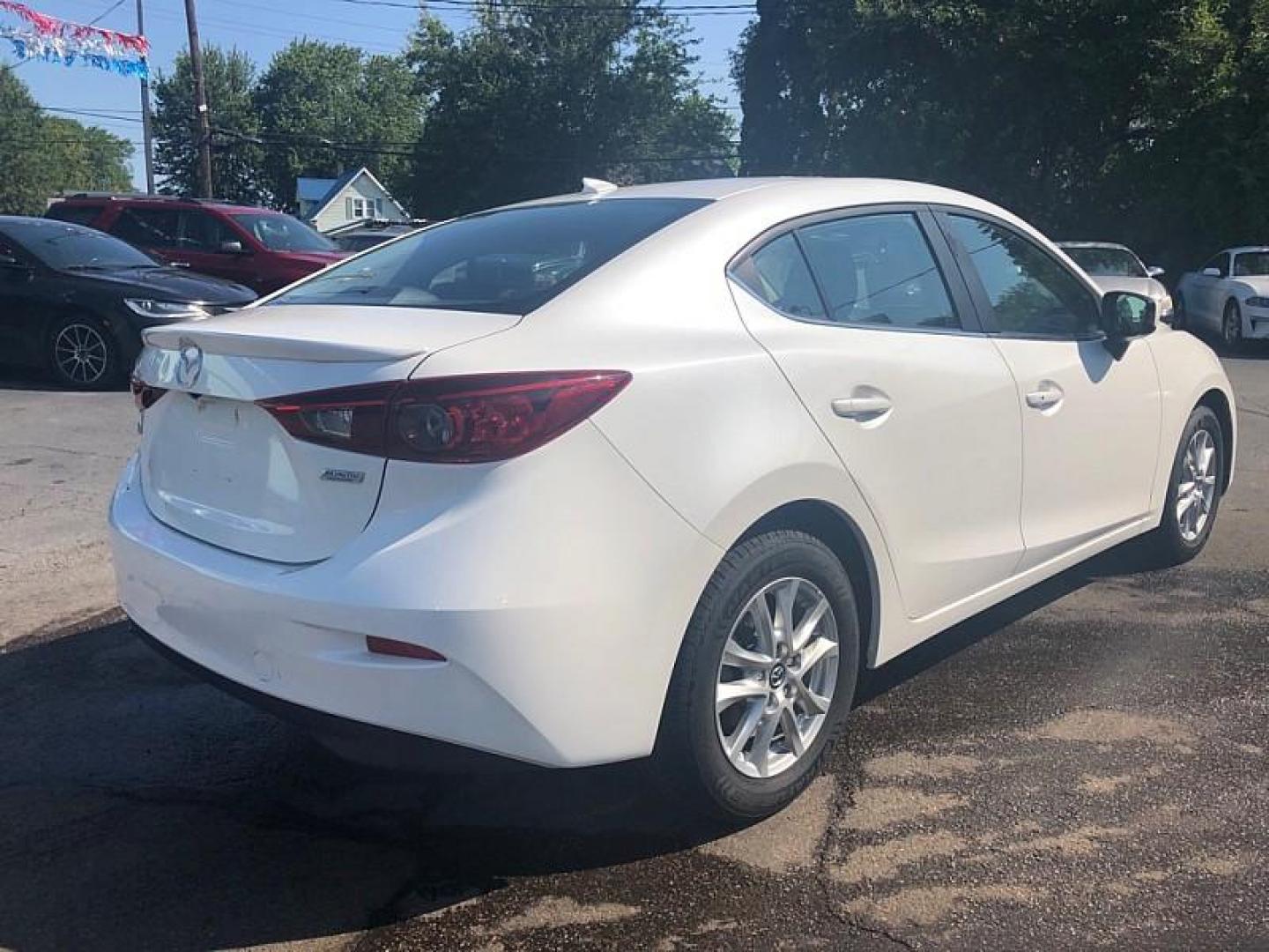 2014 WHITE /BLACK Mazda MAZDA3 i Grand Touring AT 4-Door (JM1BM1W76E1) with an 2.0L L4 DOHC 16V engine, 6-Speed Automatic transmission, located at 3304 Woodville Road, Northwood, OH, 43619, (419) 210-8019, 41.612694, -83.480743 - Your #1 Destination for Auto Loans and mdash;No Matter Your Credit!At our dealership, we cater to everyone and mdash;whether you have good, bad, or no credit. With hundreds of vehicles to choose from, you can easily find the perfect car, truck, or SUV that fits your needs.Get Approved Today!Visit ou - Photo#4