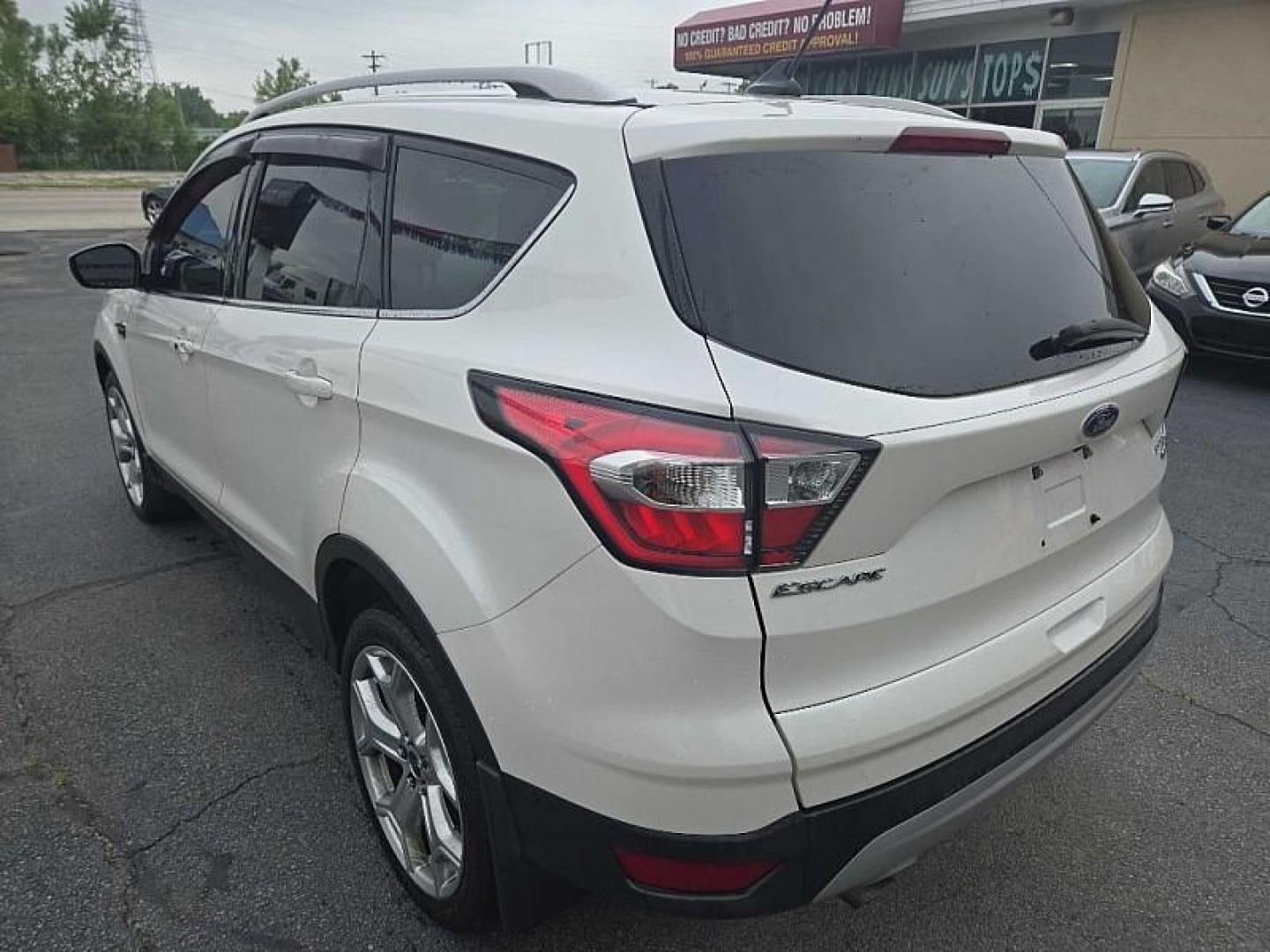 2018 WHITE /TAN Ford Escape Titanium 4WD (1FMCU9J98JU) with an 2.0L L4 DOHC 16V engine, 6A transmission, located at 3304 Woodville Road, Northwood, OH, 43619, (419) 210-8019, 41.612694, -83.480743 - We are #1 Auto Loan Dealer for Good Bad or No Credit we have hundreds of vehicles to choose from, stop on in or just fill out our online application to get approved for auto financing and see your credit score for free by visiting our website today. We have Low Payment Options and Terms Available - Photo#1