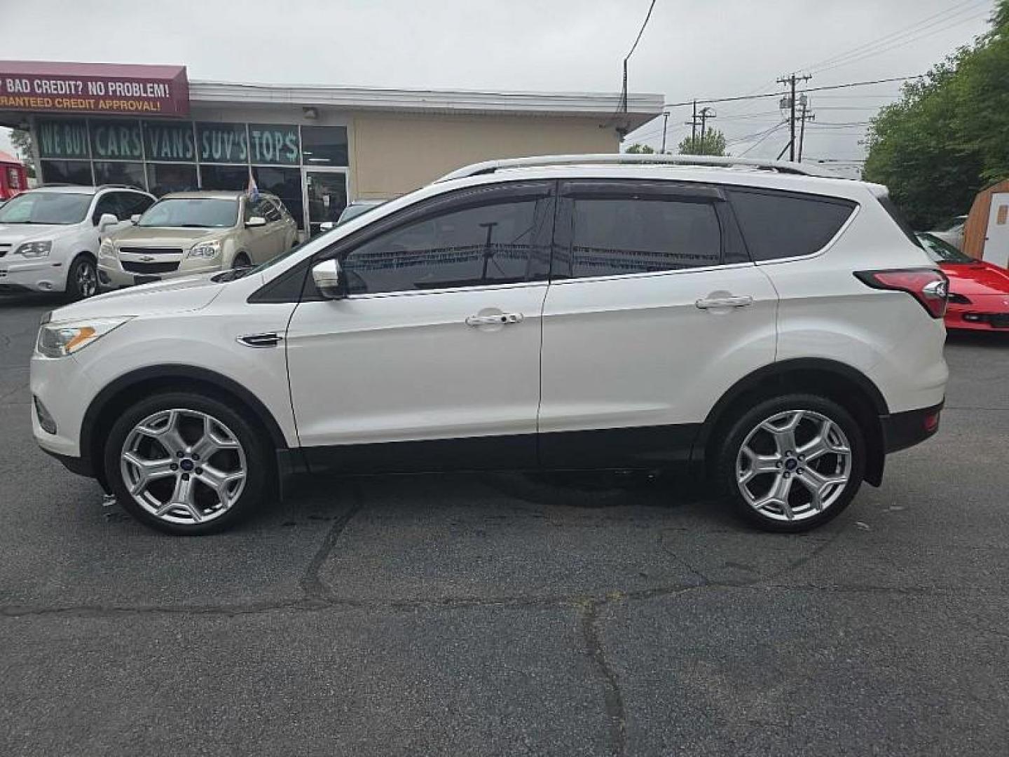 2018 WHITE /TAN Ford Escape Titanium 4WD (1FMCU9J98JU) with an 2.0L L4 DOHC 16V engine, 6A transmission, located at 3304 Woodville Road, Northwood, OH, 43619, (419) 210-8019, 41.612694, -83.480743 - We are #1 Auto Loan Dealer for Good Bad or No Credit we have hundreds of vehicles to choose from, stop on in or just fill out our online application to get approved for auto financing and see your credit score for free by visiting our website today. We have Low Payment Options and Terms Available - Photo#2