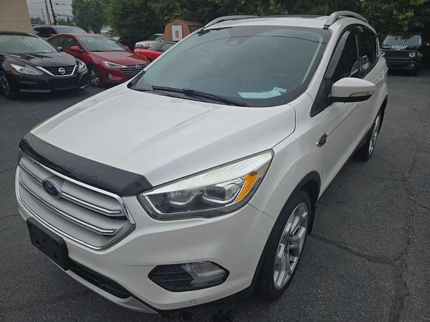 2018 WHITE /TAN Ford Escape Titanium 4WD (1FMCU9J98JU) with an 2.0L L4 DOHC 16V engine, 6A transmission, located at 3304 Woodville Road, Northwood, OH, 43619, (419) 210-8019, 41.612694, -83.480743 - We are #1 Auto Loan Dealer for Good Bad or No Credit we have hundreds of vehicles to choose from, stop on in or just fill out our online application to get approved for auto financing and see your credit score for free by visiting our website today. We have Low Payment Options and Terms Available - Photo#0