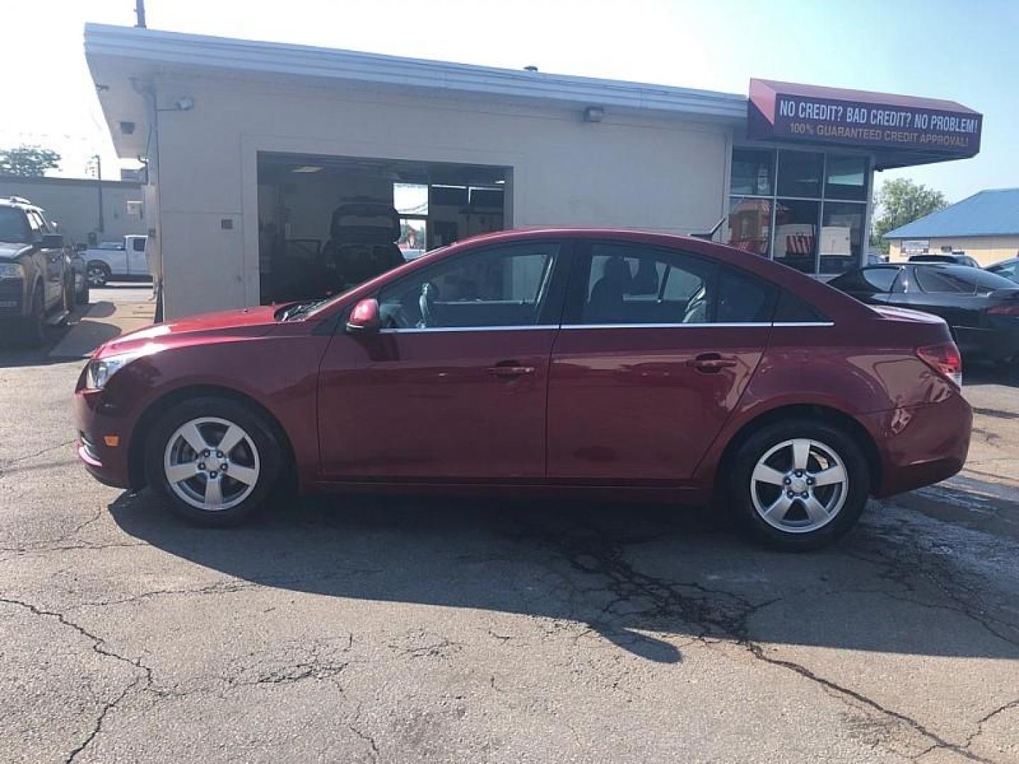 2014 RED /BLACK Chevrolet Cruze 1LT Auto (1G1PC5SB4E7) with an 1.4L L4 DOHC 16V TURBO engine, 6-Speed Automatic transmission, located at 3304 Woodville Road, Northwood, OH, 43619, (419) 210-8019, 41.612694, -83.480743 - We are #1 Auto Loan Dealer for Good Bad or No Credit we have hundreds of vehicles to choose from, stop on in or just fill out our online application to get approved for auto financing and see your credit score for free by visiting our website today. We have Low Payment Options and Terms Available - Photo#1