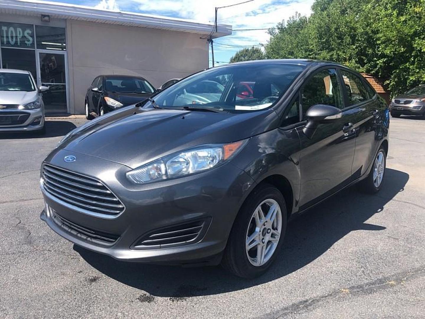 2019 GRAY /BLACK Ford Fiesta SE Sedan (3FADP4BJ8KM) with an 1.6L L4 DOHC 16V engine, Automatic 6-Spd PowerShift w/SelectShift transmission, located at 3304 Woodville Road, Northwood, OH, 43619, (419) 210-8019, 41.612694, -83.480743 - We are #1 Auto Loan Dealer for Good Bad or No Credit we have hundreds of vehicles to choose from, stop on in or just fill out our online application to get approved for auto financing and see your credit score for free by visiting our website today. We have Low Payment Options and Terms Available - Photo#0