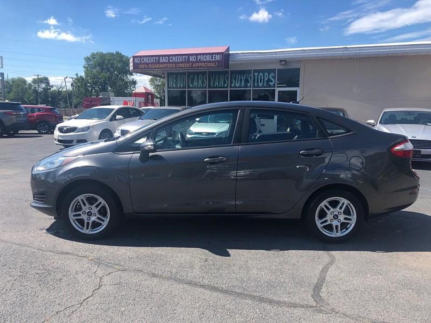 2019 GRAY /BLACK Ford Fiesta SE Sedan (3FADP4BJ8KM) with an 1.6L L4 DOHC 16V engine, Automatic 6-Spd PowerShift w/SelectShift transmission, located at 3304 Woodville Road, Northwood, OH, 43619, (419) 210-8019, 41.612694, -83.480743 - We are #1 Auto Loan Dealer for Good Bad or No Credit we have hundreds of vehicles to choose from, stop on in or just fill out our online application to get approved for auto financing and see your credit score for free by visiting our website today. We have Low Payment Options and Terms Available - Photo#1