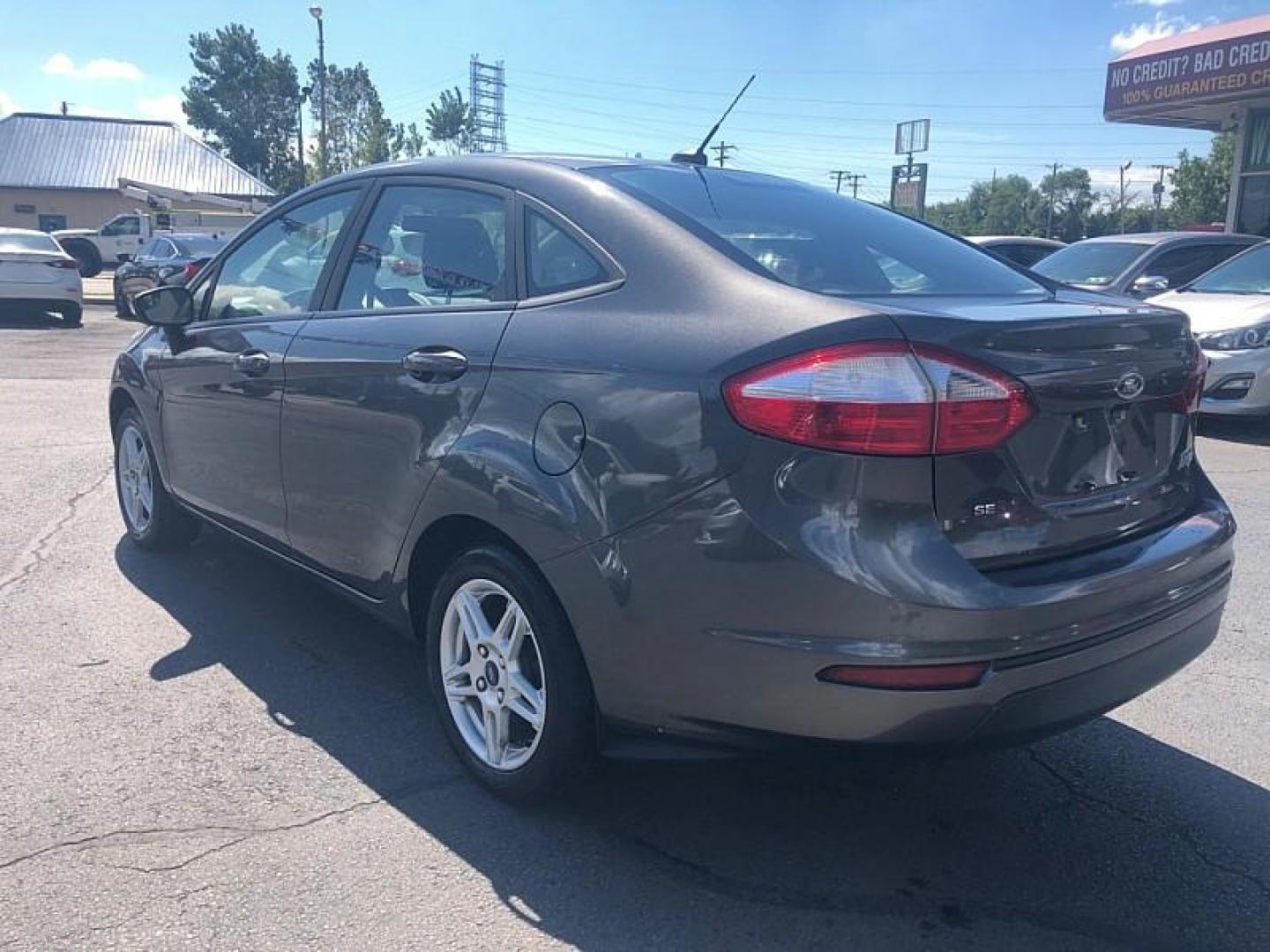 2019 GRAY /BLACK Ford Fiesta SE Sedan (3FADP4BJ8KM) with an 1.6L L4 DOHC 16V engine, Automatic 6-Spd PowerShift w/SelectShift transmission, located at 3304 Woodville Road, Northwood, OH, 43619, (419) 210-8019, 41.612694, -83.480743 - We are #1 Auto Loan Dealer for Good Bad or No Credit we have hundreds of vehicles to choose from, stop on in or just fill out our online application to get approved for auto financing and see your credit score for free by visiting our website today. We have Low Payment Options and Terms Available - Photo#2