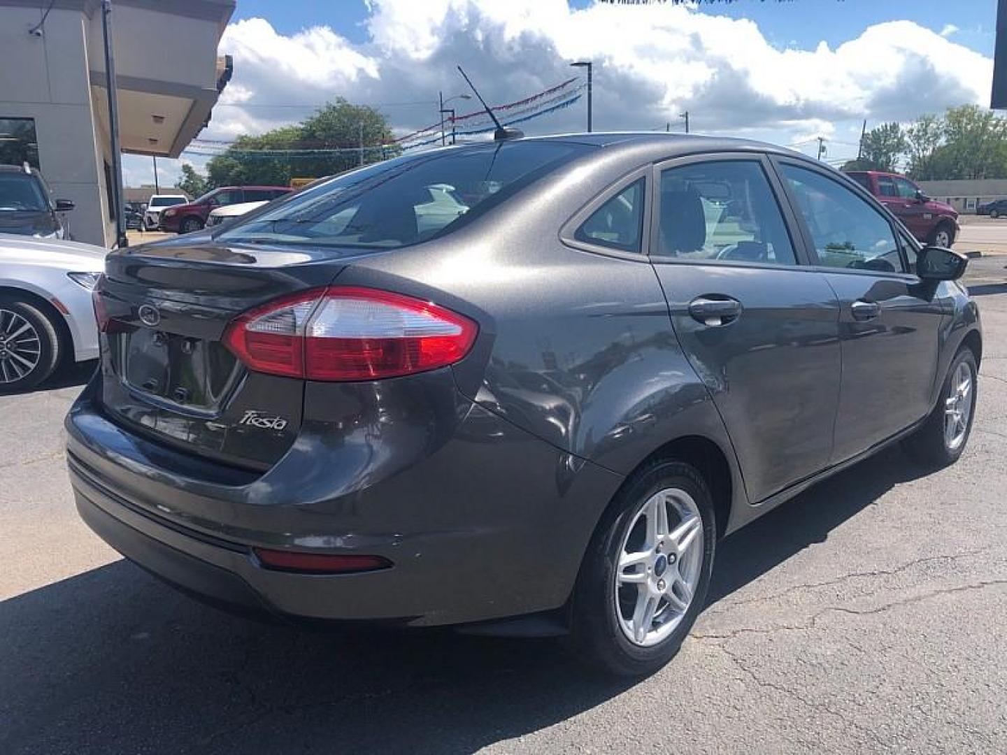 2019 GRAY /BLACK Ford Fiesta SE Sedan (3FADP4BJ8KM) with an 1.6L L4 DOHC 16V engine, Automatic 6-Spd PowerShift w/SelectShift transmission, located at 3304 Woodville Road, Northwood, OH, 43619, (419) 210-8019, 41.612694, -83.480743 - We are #1 Auto Loan Dealer for Good Bad or No Credit we have hundreds of vehicles to choose from, stop on in or just fill out our online application to get approved for auto financing and see your credit score for free by visiting our website today. We have Low Payment Options and Terms Available - Photo#4