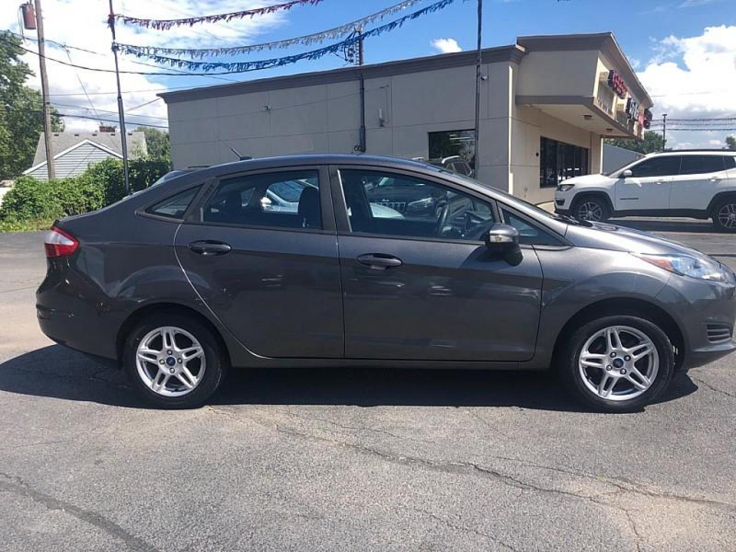 2019 GRAY /BLACK Ford Fiesta SE Sedan (3FADP4BJ8KM) with an 1.6L L4 DOHC 16V engine, Automatic 6-Spd PowerShift w/SelectShift transmission, located at 3304 Woodville Road, Northwood, OH, 43619, (419) 210-8019, 41.612694, -83.480743 - Photo#5