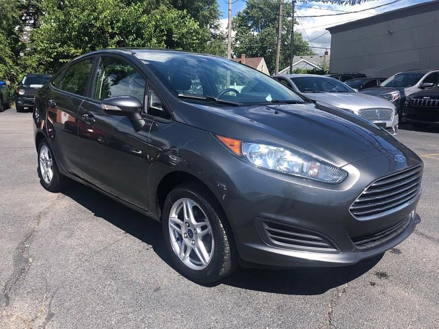 2019 GRAY /BLACK Ford Fiesta SE Sedan (3FADP4BJ8KM) with an 1.6L L4 DOHC 16V engine, Automatic 6-Spd PowerShift w/SelectShift transmission, located at 3304 Woodville Road, Northwood, OH, 43619, (419) 210-8019, 41.612694, -83.480743 - We are #1 Auto Loan Dealer for Good Bad or No Credit we have hundreds of vehicles to choose from, stop on in or just fill out our online application to get approved for auto financing and see your credit score for free by visiting our website today. We have Low Payment Options and Terms Available - Photo#6