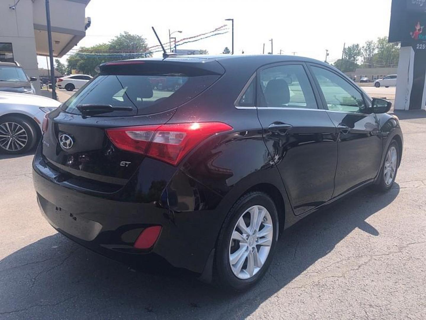 2014 BLACK /BLACKD Hyundai Elantra GT A/T (KMHD35LH6EU) with an 2.0L L4 16V DOHC engine, 6-Speed Automatic transmission, located at 3304 Woodville Road, Northwood, OH, 43619, (419) 210-8019, 41.612694, -83.480743 - We are #1 Auto Loan Dealer for Good Bad or No Credit we have hundreds of vehicles to choose from, stop on in or just fill out our online application to get approved for auto financing and see your credit score for free by visiting our website today. We have Low Payment Options and Terms Available - Photo#4