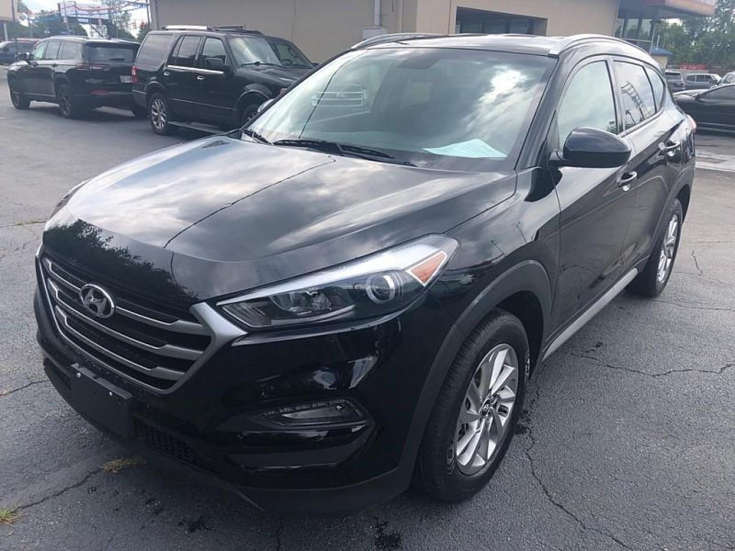 2018 BLACK /BLACK Hyundai Tucson SE (KM8J33A44JU) with an 2.0L L4 DOHC 16V engine, 6A transmission, located at 3304 Woodville Road, Northwood, OH, 43619, (419) 210-8019, 41.612694, -83.480743 - We are #1 Auto Loan Dealer for Good Bad or No Credit we have hundreds of vehicles to choose from, stop on in or just fill out our online application to get approved for auto financing and see your credit score for free by visiting our website today. We have Low Payment Options and Terms Available - Photo#0