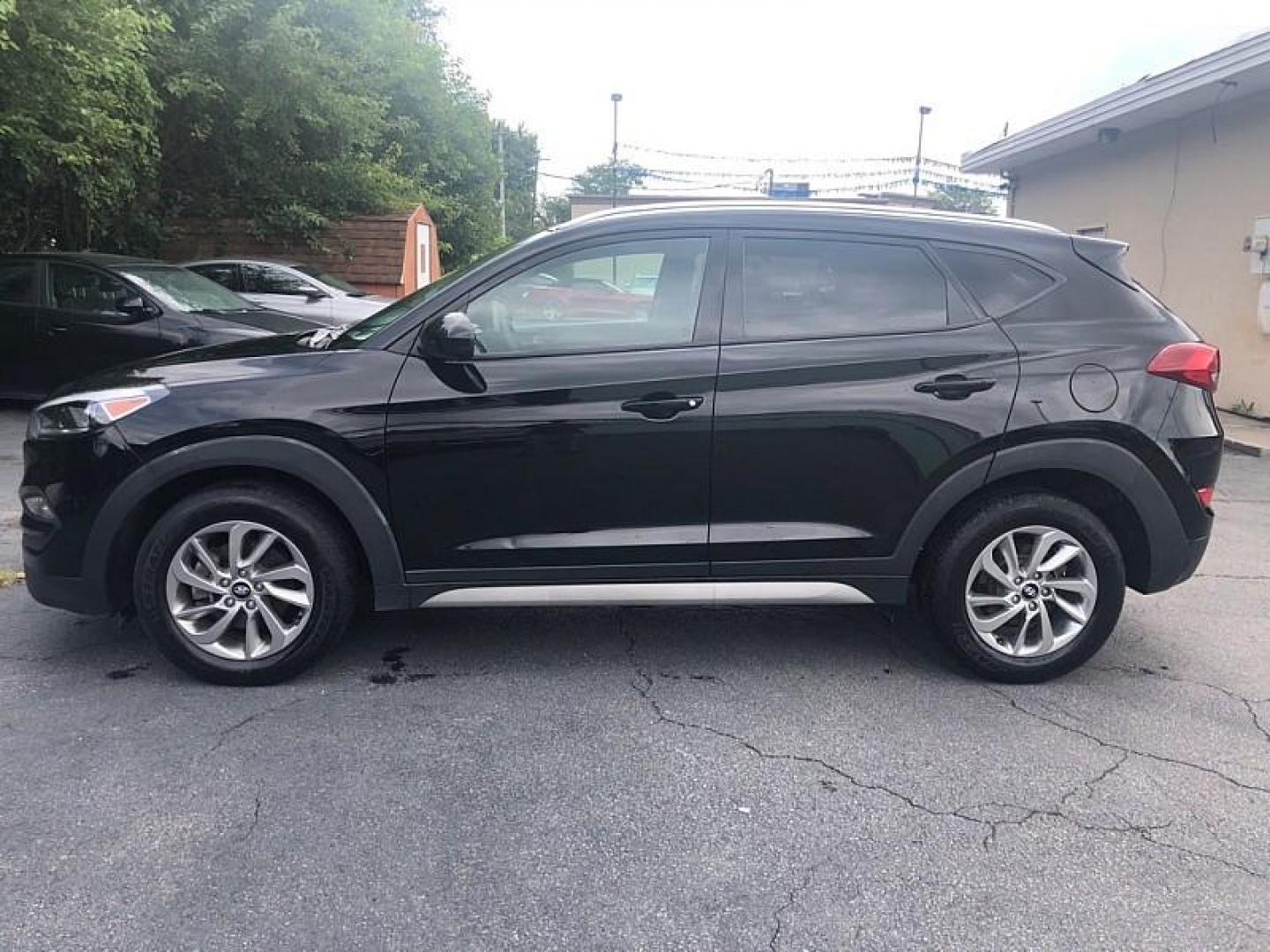 2018 BLACK /BLACK Hyundai Tucson SE (KM8J33A44JU) with an 2.0L L4 DOHC 16V engine, 6A transmission, located at 3304 Woodville Road, Northwood, OH, 43619, (419) 210-8019, 41.612694, -83.480743 - We are #1 Auto Loan Dealer for Good Bad or No Credit we have hundreds of vehicles to choose from, stop on in or just fill out our online application to get approved for auto financing and see your credit score for free by visiting our website today. We have Low Payment Options and Terms Available - Photo#1