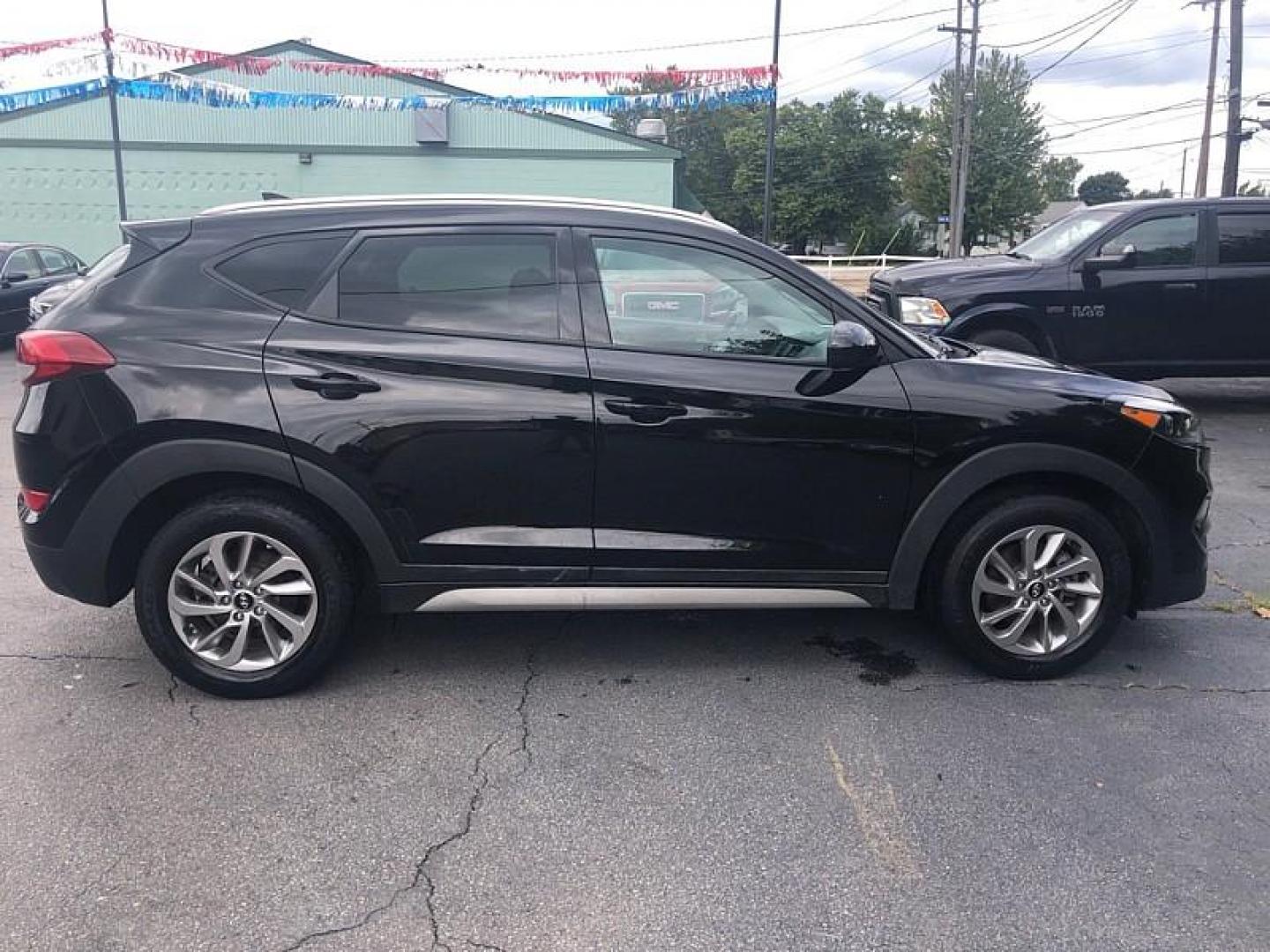 2018 BLACK /BLACK Hyundai Tucson SE (KM8J33A44JU) with an 2.0L L4 DOHC 16V engine, 6A transmission, located at 3304 Woodville Road, Northwood, OH, 43619, (419) 210-8019, 41.612694, -83.480743 - We are #1 Auto Loan Dealer for Good Bad or No Credit we have hundreds of vehicles to choose from, stop on in or just fill out our online application to get approved for auto financing and see your credit score for free by visiting our website today. We have Low Payment Options and Terms Available - Photo#5