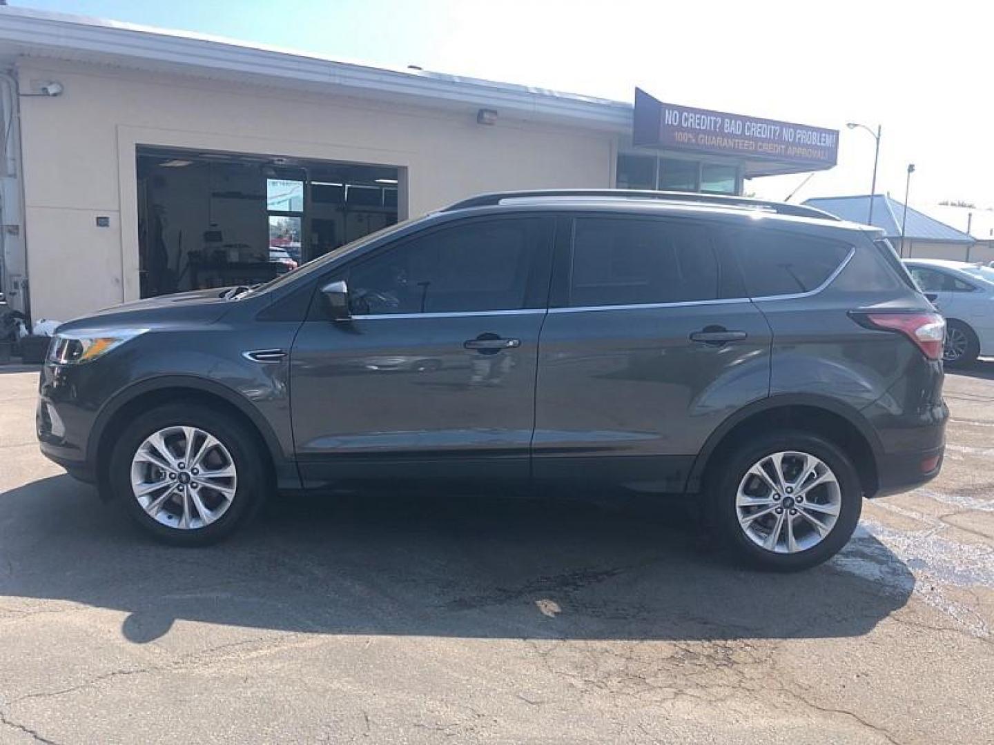 2018 GRAY /GREY Ford Escape SE 4WD (1FMCU9GD9JU) with an 1.5L L4 DOHC 16V engine, 6A transmission, located at 3304 Woodville Road, Northwood, OH, 43619, (419) 210-8019, 41.612694, -83.480743 - We are #1 Auto Loan Dealer for Good Bad or No Credit we have hundreds of vehicles to choose from, stop on in or just fill out our online application to get approved for auto financing and see your credit score for free by visiting our website today. We have Low Payment Options and Terms Available - Photo#1