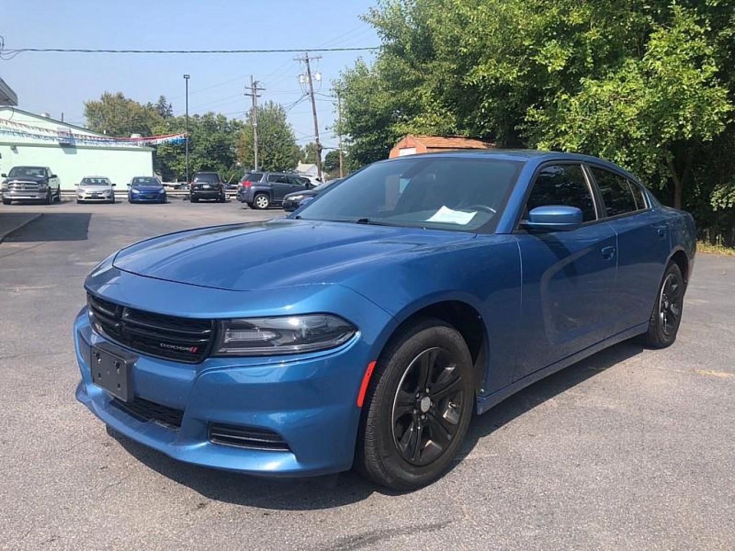 2021 BLUE /BLACK Dodge Charger SXT (2C3CDXBG1MH) with an 3.6L V6 DOHC 24V engine, 8A transmission, located at 3304 Woodville Road, Northwood, OH, 43619, (419) 210-8019, 41.612694, -83.480743 - We are #1 Auto Loan Dealer for Good Bad or No Credit we have hundreds of vehicles to choose from, stop on in or just fill out our online application to get approved for auto financing and see your credit score for free by visiting our website today. We have Low Payment Options and Terms Available - Photo#0