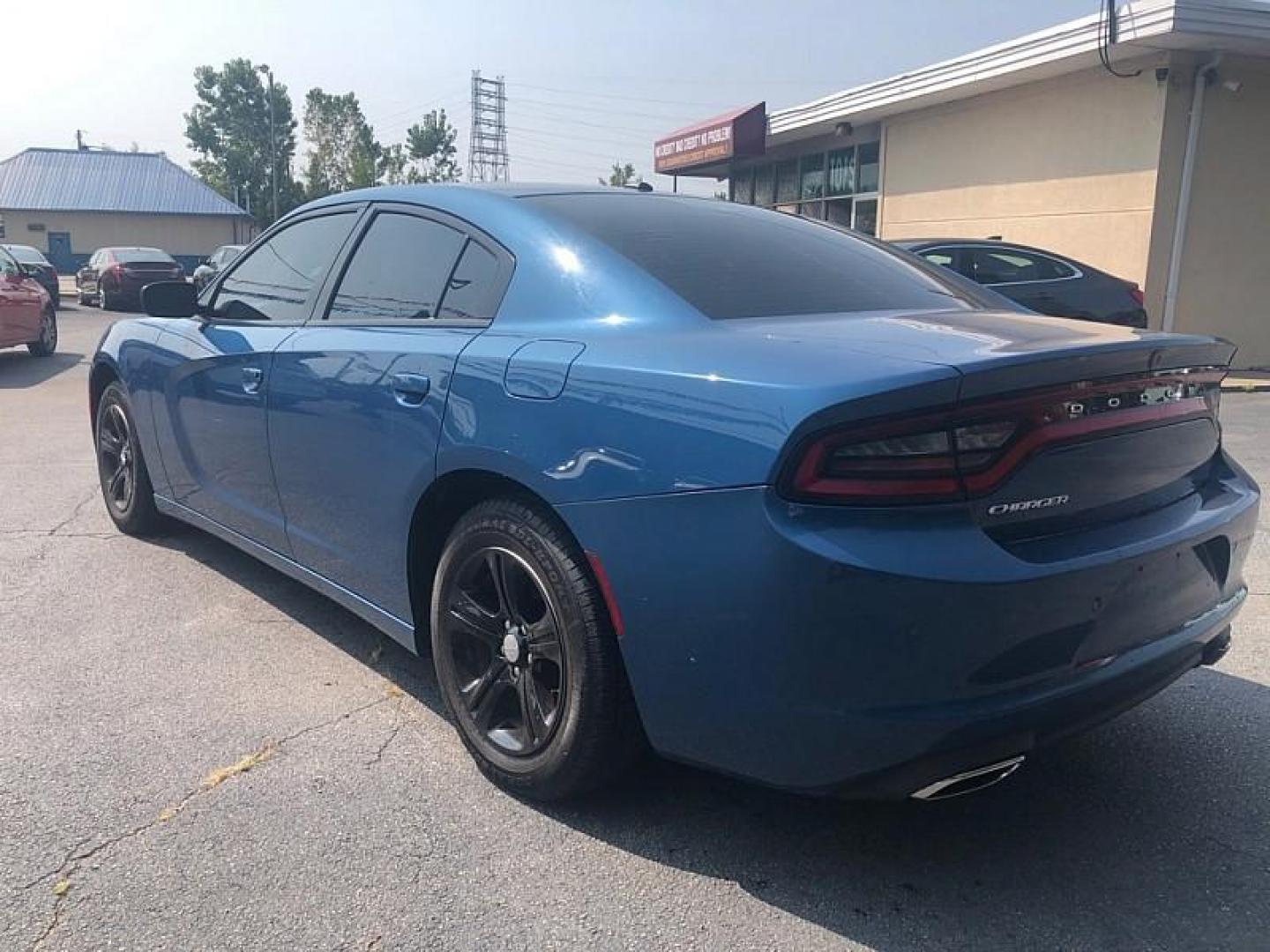 2021 BLUE /BLACK Dodge Charger SXT (2C3CDXBG1MH) with an 3.6L V6 DOHC 24V engine, 8A transmission, located at 3304 Woodville Road, Northwood, OH, 43619, (419) 210-8019, 41.612694, -83.480743 - We are #1 Auto Loan Dealer for Good Bad or No Credit we have hundreds of vehicles to choose from, stop on in or just fill out our online application to get approved for auto financing and see your credit score for free by visiting our website today. We have Low Payment Options and Terms Available - Photo#2