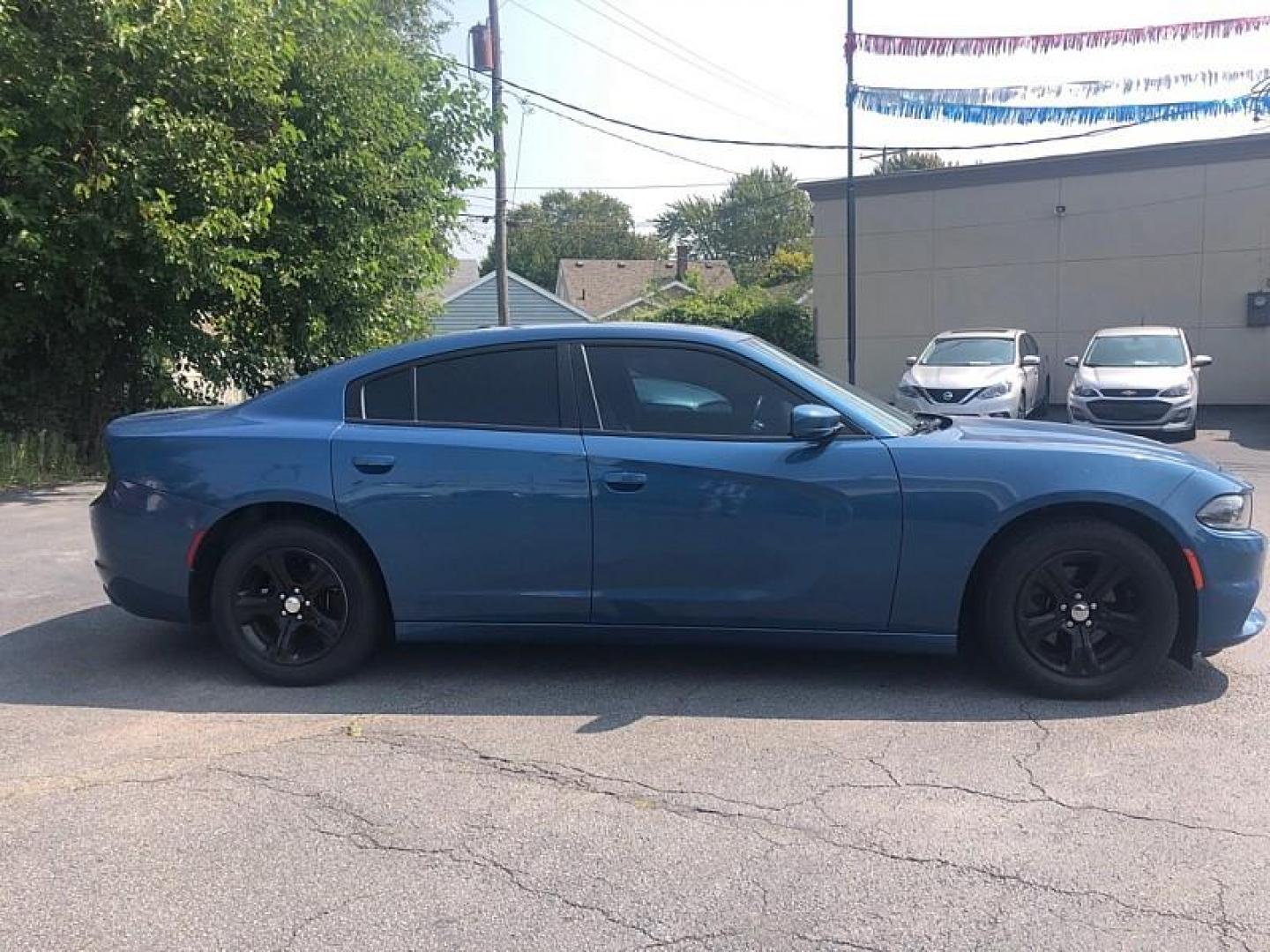 2021 BLUE /BLACK Dodge Charger SXT (2C3CDXBG1MH) with an 3.6L V6 DOHC 24V engine, 8A transmission, located at 3304 Woodville Road, Northwood, OH, 43619, (419) 210-8019, 41.612694, -83.480743 - We are #1 Auto Loan Dealer for Good Bad or No Credit we have hundreds of vehicles to choose from, stop on in or just fill out our online application to get approved for auto financing and see your credit score for free by visiting our website today. We have Low Payment Options and Terms Available - Photo#5