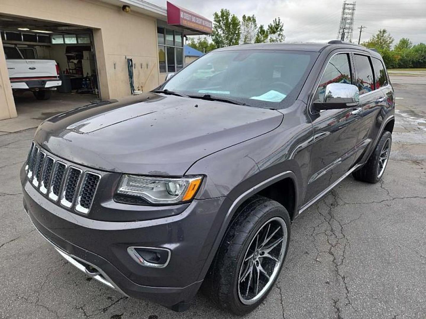 2015 GRAY /BLACK Jeep Grand Cherokee Overland 4WD (1C4RJFCGXFC) with an 3.6L V6 DOHC 24V engine, 8-Speed Automatic transmission, located at 3304 Woodville Road, Northwood, OH, 43619, (419) 210-8019, 41.612694, -83.480743 - We are #1 Auto Loan Dealer for Good Bad or No Credit we have hundreds of vehicles to choose from, stop on in or just fill out our online application to get approved for auto financing and see your credit score for free by visiting our website today. We have Low Payment Options and Terms Available - Photo#0