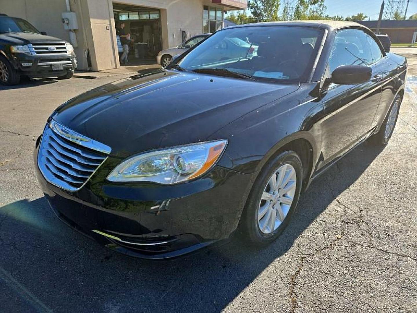 2013 BLACK /BLACK Chrysler 200 Touring Convertible (1C3BCBEB2DN) with an 2.4L L4 DOHC 16V engine, 6-Speed Automatic transmission, located at 3304 Woodville Road, Northwood, OH, 43619, (419) 210-8019, 41.612694, -83.480743 - We are #1 Auto Loan Dealer for Good Bad or No Credit we have hundreds of vehicles to choose from, stop on in or just fill out our online application to get approved for auto financing and see your credit score for free by visiting our website today. We have Low Payment Options and Terms Available - Photo#0