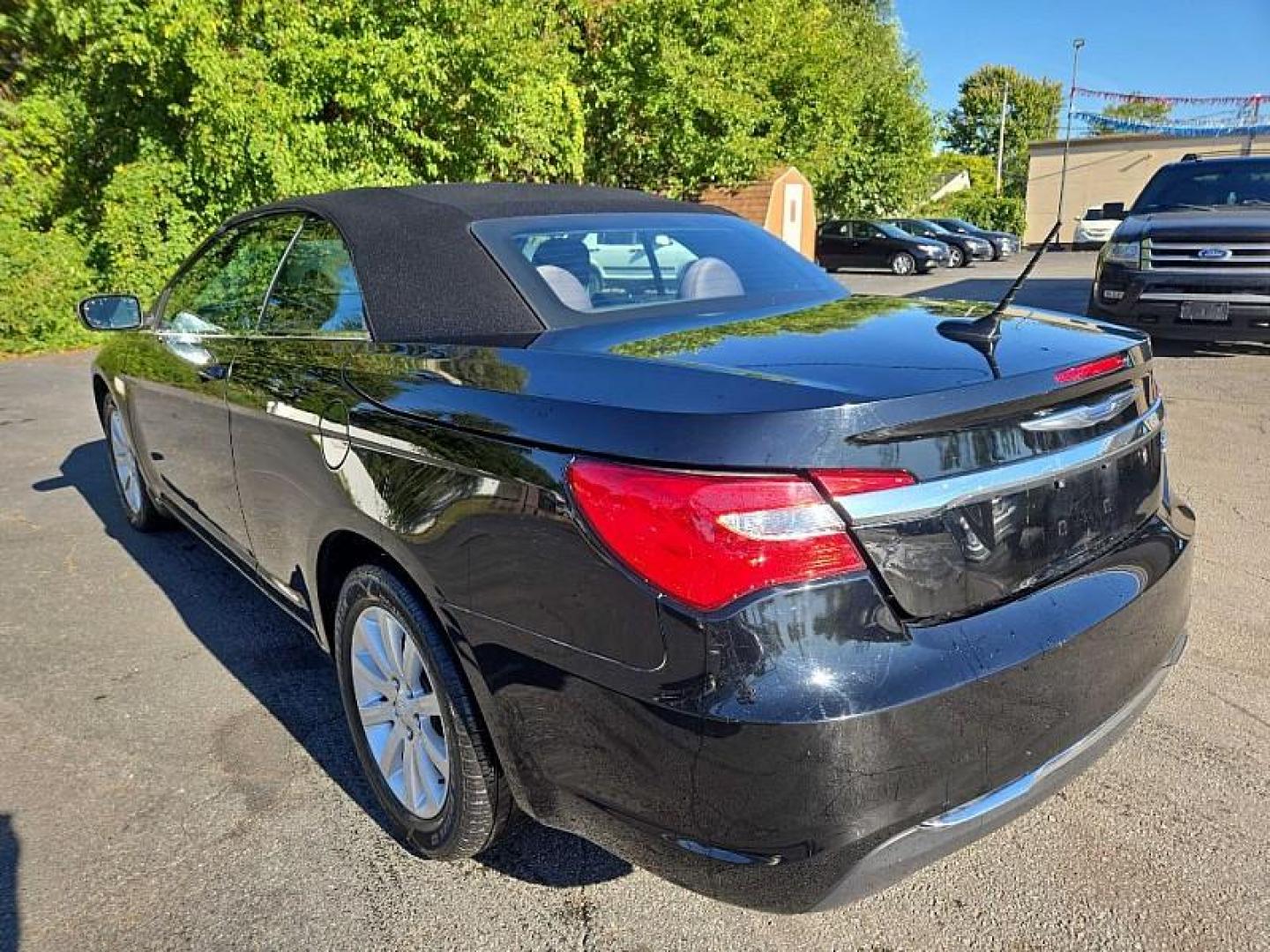 2013 BLACK /BLACK Chrysler 200 Touring Convertible (1C3BCBEB2DN) with an 2.4L L4 DOHC 16V engine, 6-Speed Automatic transmission, located at 3304 Woodville Road, Northwood, OH, 43619, (419) 210-8019, 41.612694, -83.480743 - We are #1 Auto Loan Dealer for Good Bad or No Credit we have hundreds of vehicles to choose from, stop on in or just fill out our online application to get approved for auto financing and see your credit score for free by visiting our website today. We have Low Payment Options and Terms Available - Photo#2