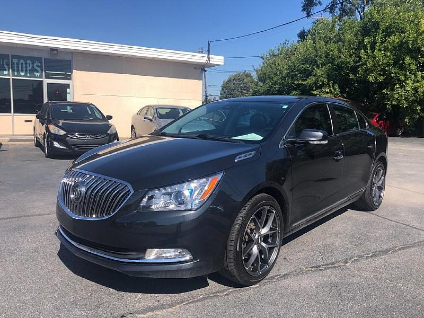 2014 BLACK /BLACK Buick LaCrosse Premium Package 1, w/Leather AWD (1G4GE5G39EF) with an 3.6L V6 DOHC 24V FFV engine, 6-Speed Automatic transmission, located at 3304 Woodville Road, Northwood, OH, 43619, (419) 210-8019, 41.612694, -83.480743 - We are #1 Auto Loan Dealer for Good Bad or No Credit we have hundreds of vehicles to choose from, stop on in or just fill out our online application to get approved for auto financing and see your credit score for free by visiting our website today. We have Low Payment Options and Terms Available - Photo#0