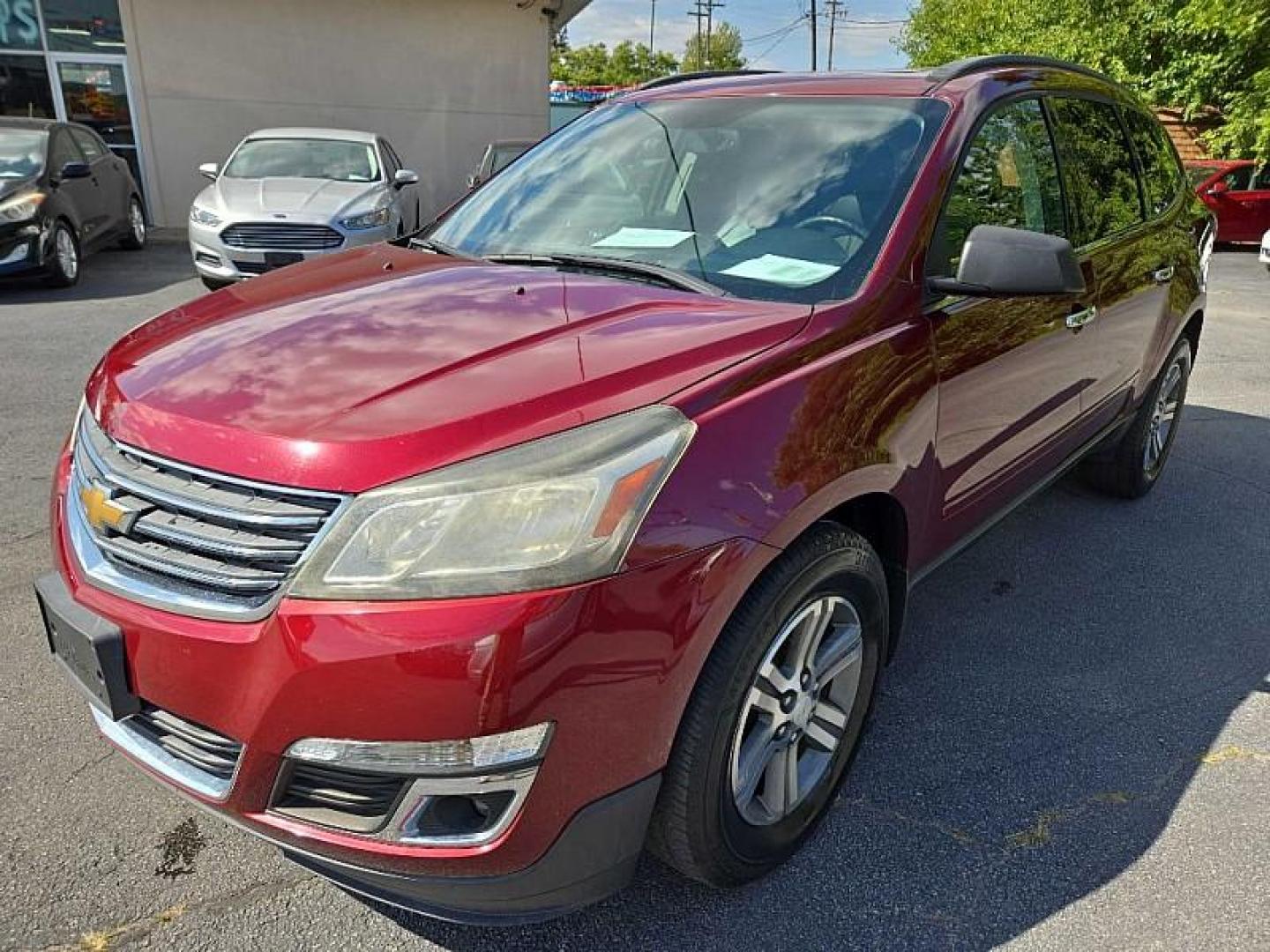 2015 RED /BLACK Chevrolet Traverse 2LT AWD (1GNKVHKD2FJ) with an 3.6L V6 DOHC 24V engine, 6-Speed Automatic transmission, located at 3304 Woodville Road, Northwood, OH, 43619, (419) 210-8019, 41.612694, -83.480743 - We are #1 Auto Loan Dealer for Good Bad or No Credit we have hundreds of vehicles to choose from, stop on in or just fill out our online application to get approved for auto financing and see your credit score for free by visiting our website today. We have Low Payment Options and Terms Available - Photo#0