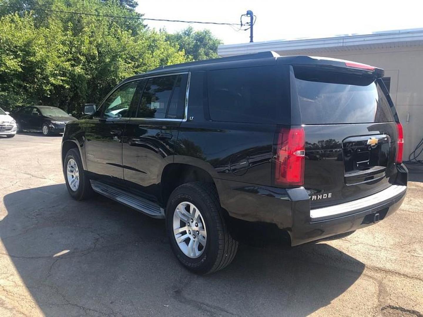 2015 BLACK /BLACK Chevrolet Tahoe LT 2WD (1GNSCBKC0FR) with an 5.3L V8 OHV 16V engine, 6-Speed Automatic transmission, located at 3304 Woodville Road, Northwood, OH, 43619, (419) 210-8019, 41.612694, -83.480743 - We are #1 Auto Loan Dealer for Good Bad or No Credit we have hundreds of vehicles to choose from, stop on in or just fill out our online application to get approved for auto financing and see your credit score for free by visiting our website today. We have Low Payment Options and Terms Available - Photo#2