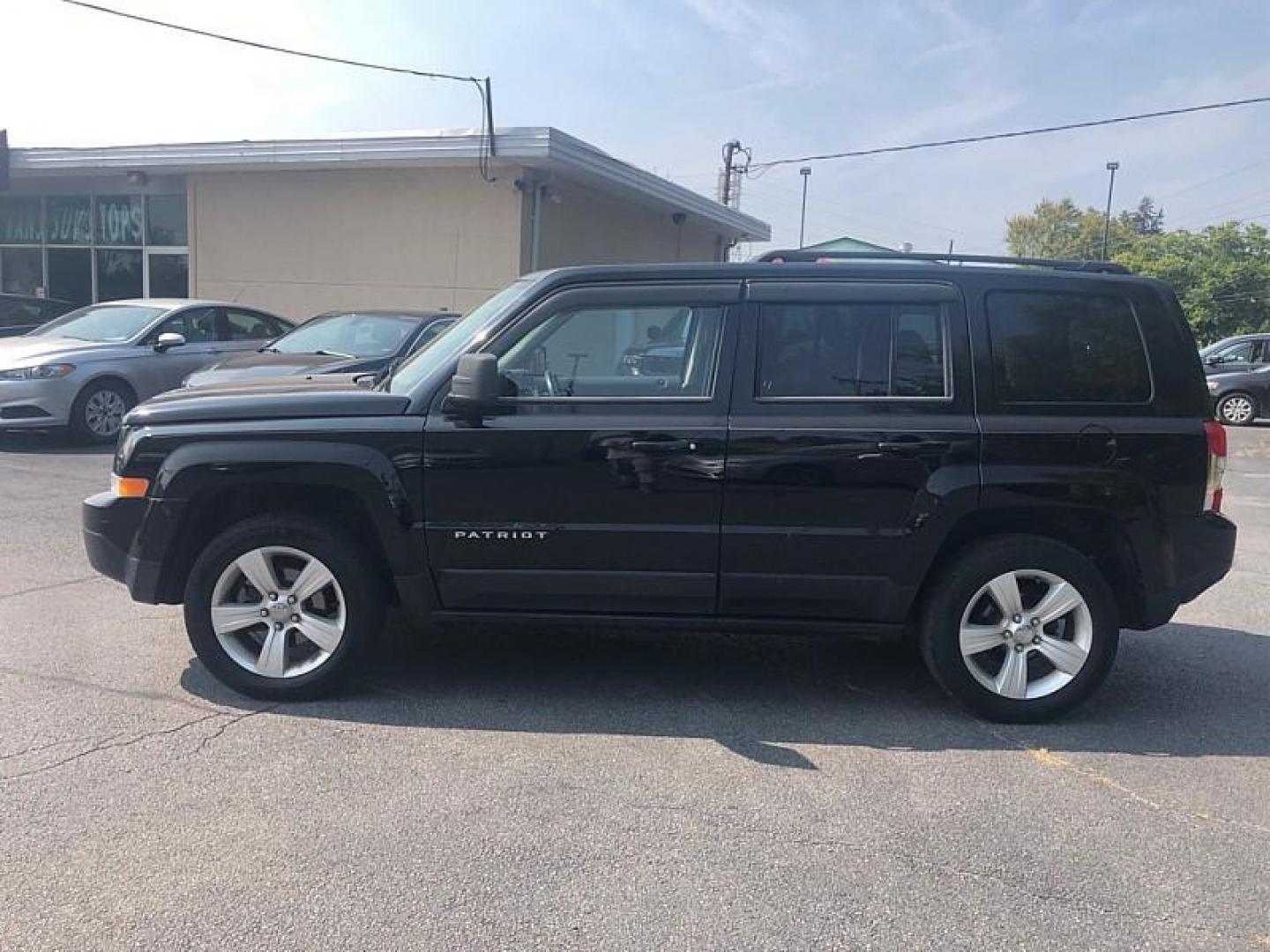 2014 BLACK /BLACK Jeep Patriot Latitude 4WD (1C4NJRFB0ED) with an 2.4L L4 DOHC 16V engine, Automatic 6-Spd w/AutoStick transmission, located at 3304 Woodville Road, Northwood, OH, 43619, (419) 210-8019, 41.612694, -83.480743 - We are #1 Auto Loan Dealer for Good Bad or No Credit we have hundreds of vehicles to choose from, stop on in or just fill out our online application to get approved for auto financing and see your credit score for free by visiting our website today. We have Low Payment Options and Terms Available - Photo#1