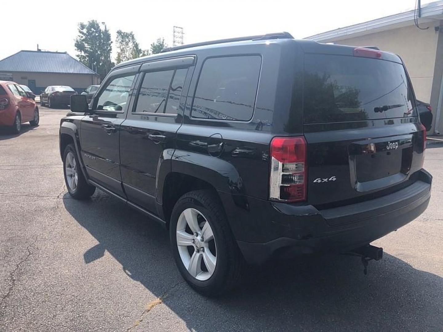 2014 BLACK /BLACK Jeep Patriot Latitude 4WD (1C4NJRFB0ED) with an 2.4L L4 DOHC 16V engine, Automatic 6-Spd w/AutoStick transmission, located at 3304 Woodville Road, Northwood, OH, 43619, (419) 210-8019, 41.612694, -83.480743 - We are #1 Auto Loan Dealer for Good Bad or No Credit we have hundreds of vehicles to choose from, stop on in or just fill out our online application to get approved for auto financing and see your credit score for free by visiting our website today. We have Low Payment Options and Terms Available - Photo#2