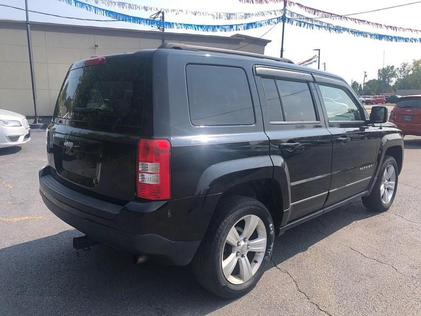 2014 BLACK /BLACK Jeep Patriot Latitude 4WD (1C4NJRFB0ED) with an 2.4L L4 DOHC 16V engine, Automatic 6-Spd w/AutoStick transmission, located at 3304 Woodville Road, Northwood, OH, 43619, (419) 210-8019, 41.612694, -83.480743 - We are #1 Auto Loan Dealer for Good Bad or No Credit we have hundreds of vehicles to choose from, stop on in or just fill out our online application to get approved for auto financing and see your credit score for free by visiting our website today. We have Low Payment Options and Terms Available - Photo#4