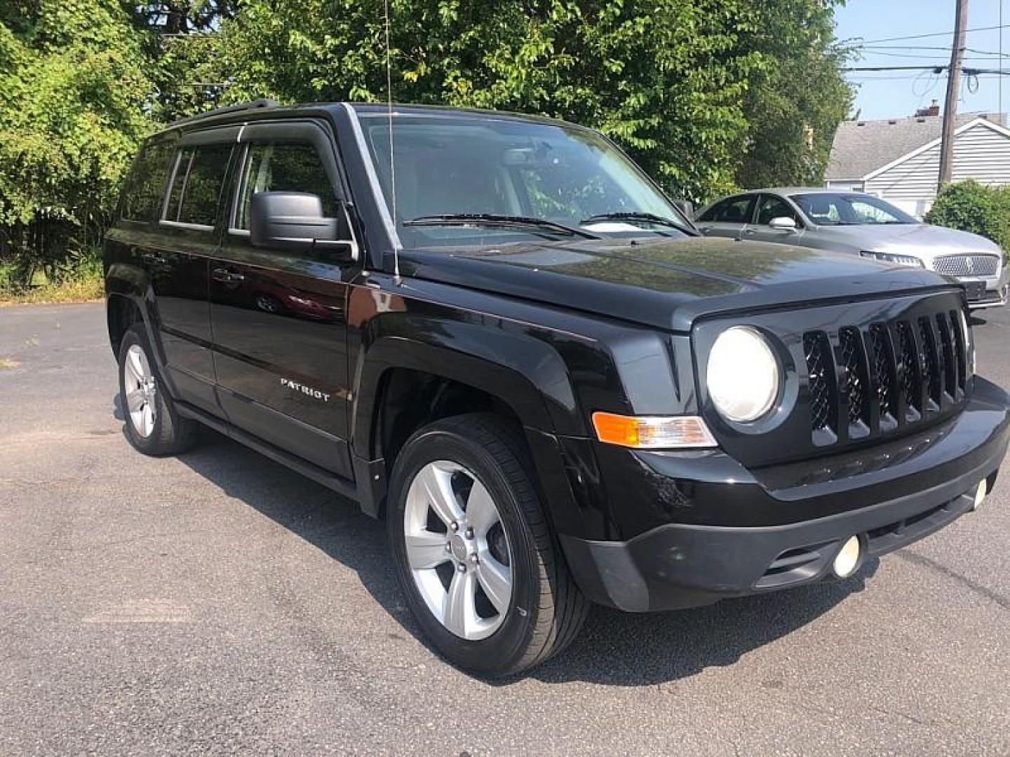 2014 BLACK /BLACK Jeep Patriot Latitude 4WD (1C4NJRFB0ED) with an 2.4L L4 DOHC 16V engine, Automatic 6-Spd w/AutoStick transmission, located at 3304 Woodville Road, Northwood, OH, 43619, (419) 210-8019, 41.612694, -83.480743 - We are #1 Auto Loan Dealer for Good Bad or No Credit we have hundreds of vehicles to choose from, stop on in or just fill out our online application to get approved for auto financing and see your credit score for free by visiting our website today. We have Low Payment Options and Terms Available - Photo#6