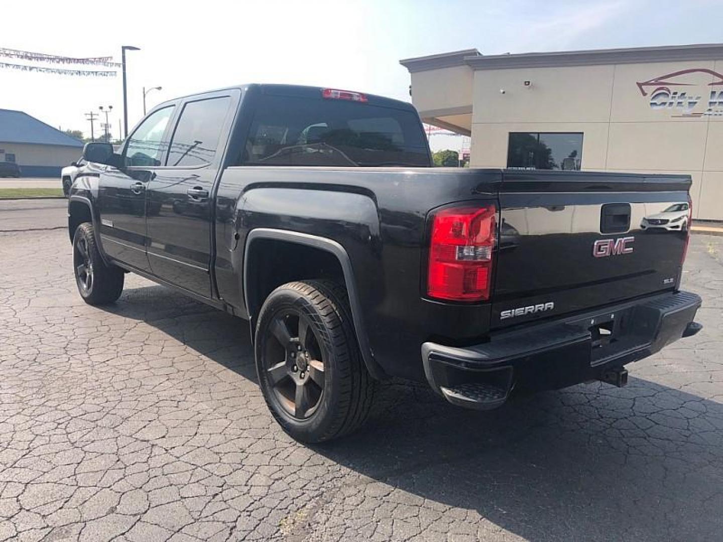 2018 BLACK /BLACK GMC Sierra 1500 SLE Crew Cab Long Box 4WD (3GTU2MEC5JG) with an 5.3L V8 OHV 16V engine, 6A transmission, located at 3304 Woodville Road, Northwood, OH, 43619, (419) 210-8019, 41.612694, -83.480743 - We are #1 Auto Loan Dealer for Good Bad or No Credit we have hundreds of vehicles to choose from, stop on in or just fill out our online application to get approved for auto financing and see your credit score for free by visiting our website today. We have Low Payment Options and Terms Available - Photo#2