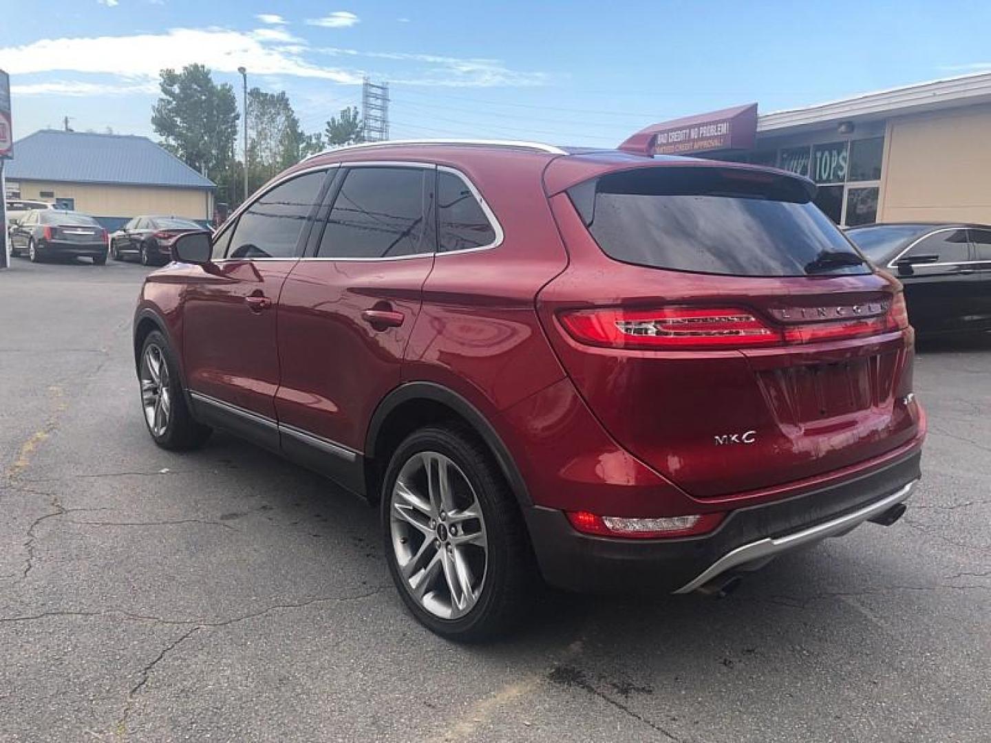 2015 RED /BLACK Lincoln MKC AWD (5LMTJ2AH6FU) with an 2.3L L4 DOHC 16V engine, 6-Speed Automatic transmission, located at 3304 Woodville Road, Northwood, OH, 43619, (419) 210-8019, 41.612694, -83.480743 - We are #1 Auto Loan Dealer for Good Bad or No Credit we have hundreds of vehicles to choose from, stop on in or just fill out our online application to get approved for auto financing and see your credit score for free by visiting our website today. We have Low Payment Options and Terms Available - Photo#2