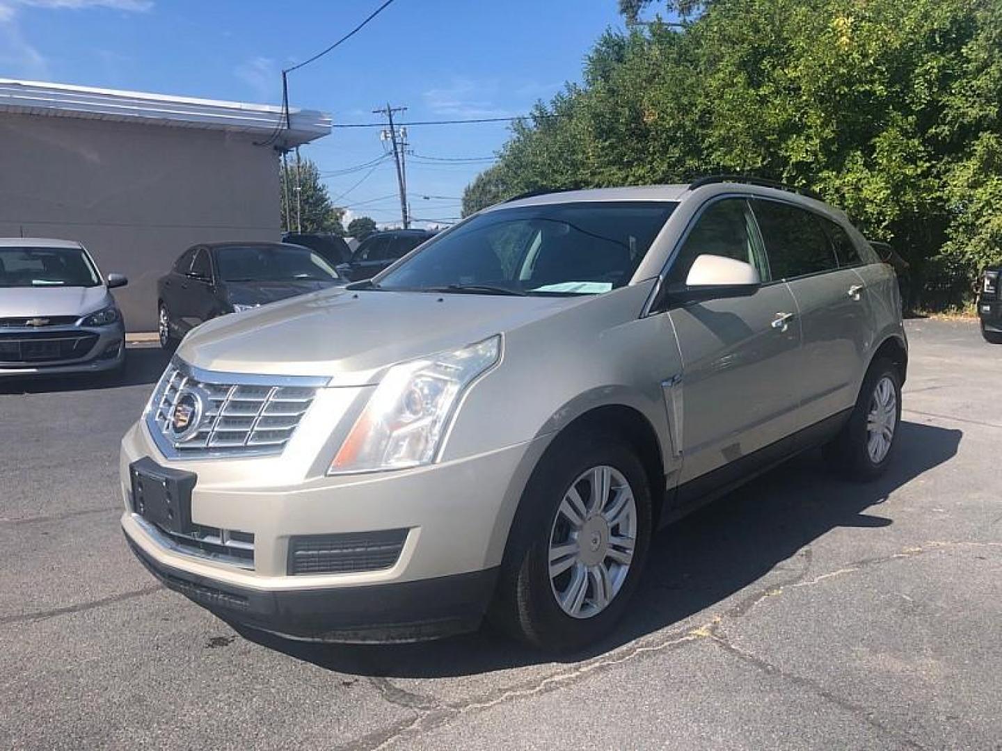 2016 GOLD /BLACK Cadillac SRX Standard FWD (3GYFNAE3XGS) with an 3.6L V6 DOHC 24V FFV engine, 6A transmission, located at 3304 Woodville Road, Northwood, OH, 43619, (419) 210-8019, 41.612694, -83.480743 - Photo#0