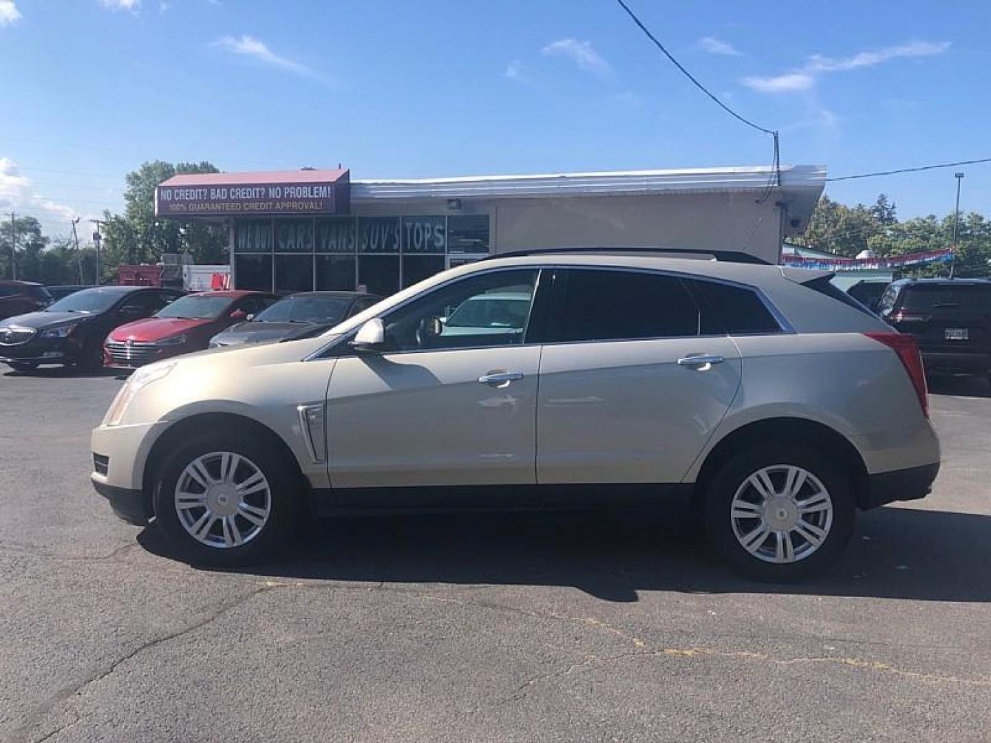 2016 GOLD /BLACK Cadillac SRX Standard FWD (3GYFNAE3XGS) with an 3.6L V6 DOHC 24V FFV engine, 6A transmission, located at 3304 Woodville Road, Northwood, OH, 43619, (419) 210-8019, 41.612694, -83.480743 - Photo#1