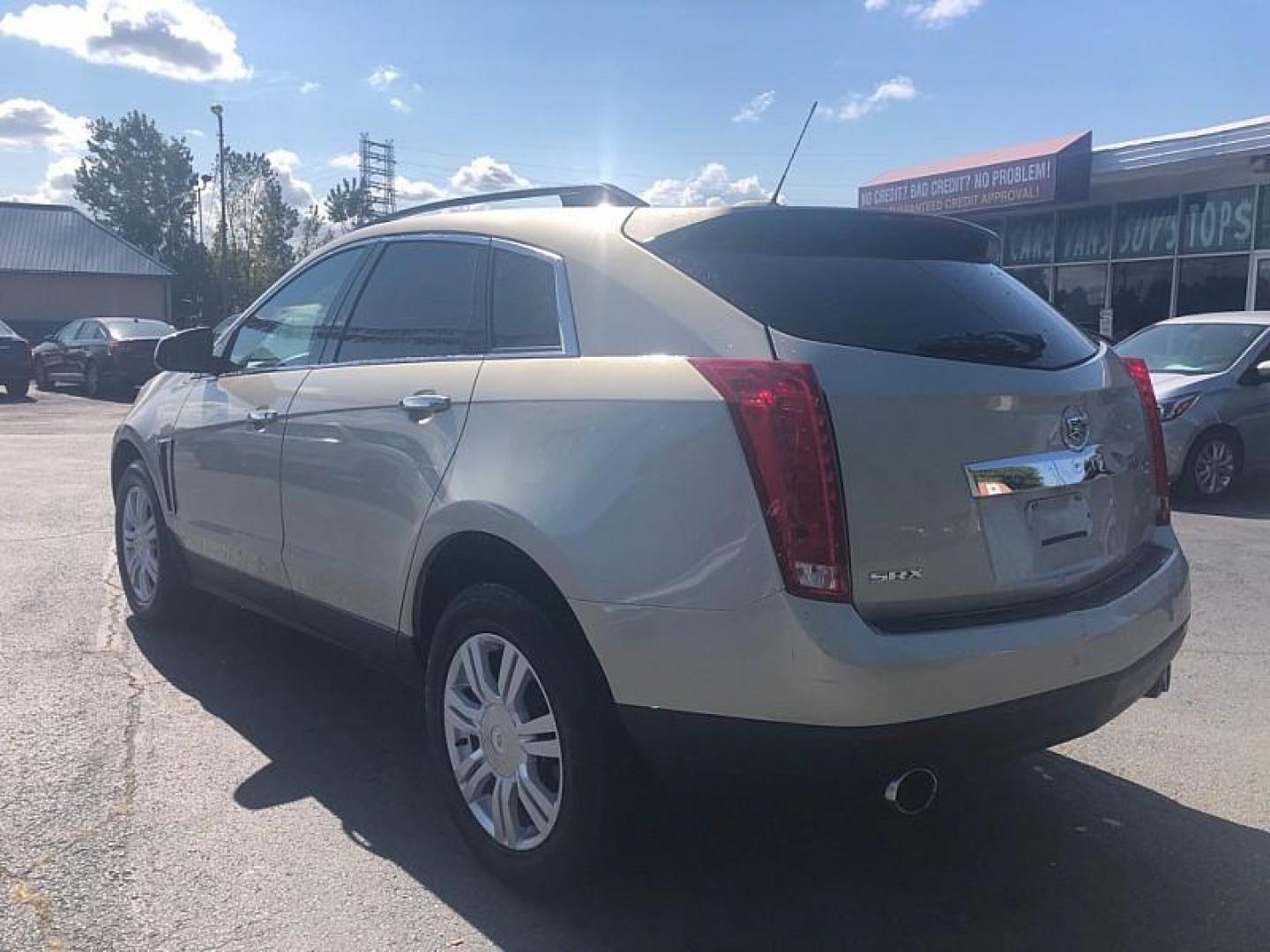 2016 GOLD /BLACK Cadillac SRX Standard FWD (3GYFNAE3XGS) with an 3.6L V6 DOHC 24V FFV engine, 6A transmission, located at 3304 Woodville Road, Northwood, OH, 43619, (419) 210-8019, 41.612694, -83.480743 - We are #1 Auto Loan Dealer for Good Bad or No Credit we have hundreds of vehicles to choose from, stop on in or just fill out our online application to get approved for auto financing and see your credit score for free by visiting our website today. We have Low Payment Options and Terms Available - Photo#2