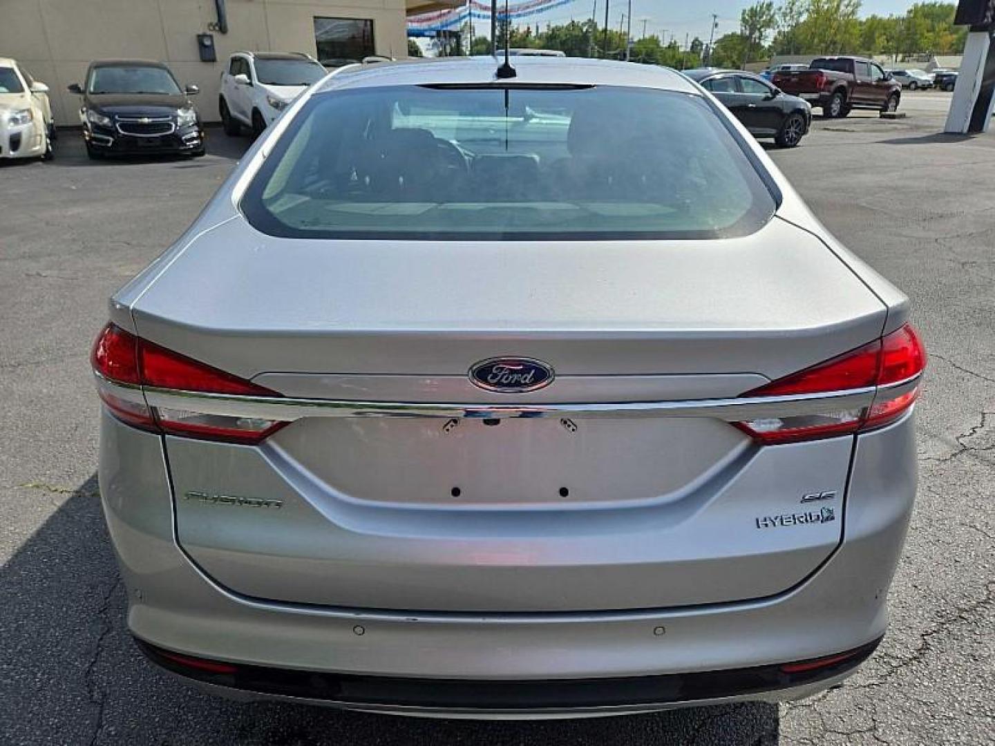 2018 SILVER /BLACK Ford Fusion Hybrid SE (3FA6P0LU9JR) with an 2.0L L4 DOHC 16V HYBRID engine, CVT transmission, located at 3304 Woodville Road, Northwood, OH, 43619, (419) 210-8019, 41.612694, -83.480743 - Your #1 Destination for Auto Loans and mdash;No Matter Your Credit!At our dealership, we cater to everyone and mdash;whether you have good, bad, or no credit. With hundreds of vehicles to choose from, you can easily find the perfect car, truck, or SUV that fits your needs.Get Approved Today!Visit ou - Photo#3