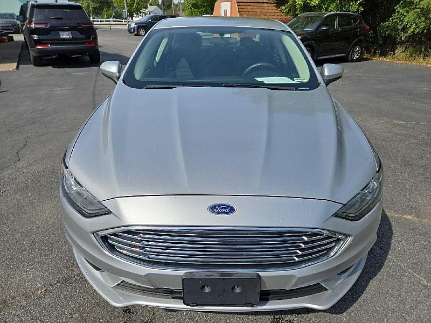 2018 SILVER /BLACK Ford Fusion Hybrid SE (3FA6P0LU9JR) with an 2.0L L4 DOHC 16V HYBRID engine, CVT transmission, located at 3304 Woodville Road, Northwood, OH, 43619, (419) 210-8019, 41.612694, -83.480743 - Your #1 Destination for Auto Loans and mdash;No Matter Your Credit!At our dealership, we cater to everyone and mdash;whether you have good, bad, or no credit. With hundreds of vehicles to choose from, you can easily find the perfect car, truck, or SUV that fits your needs.Get Approved Today!Visit ou - Photo#7