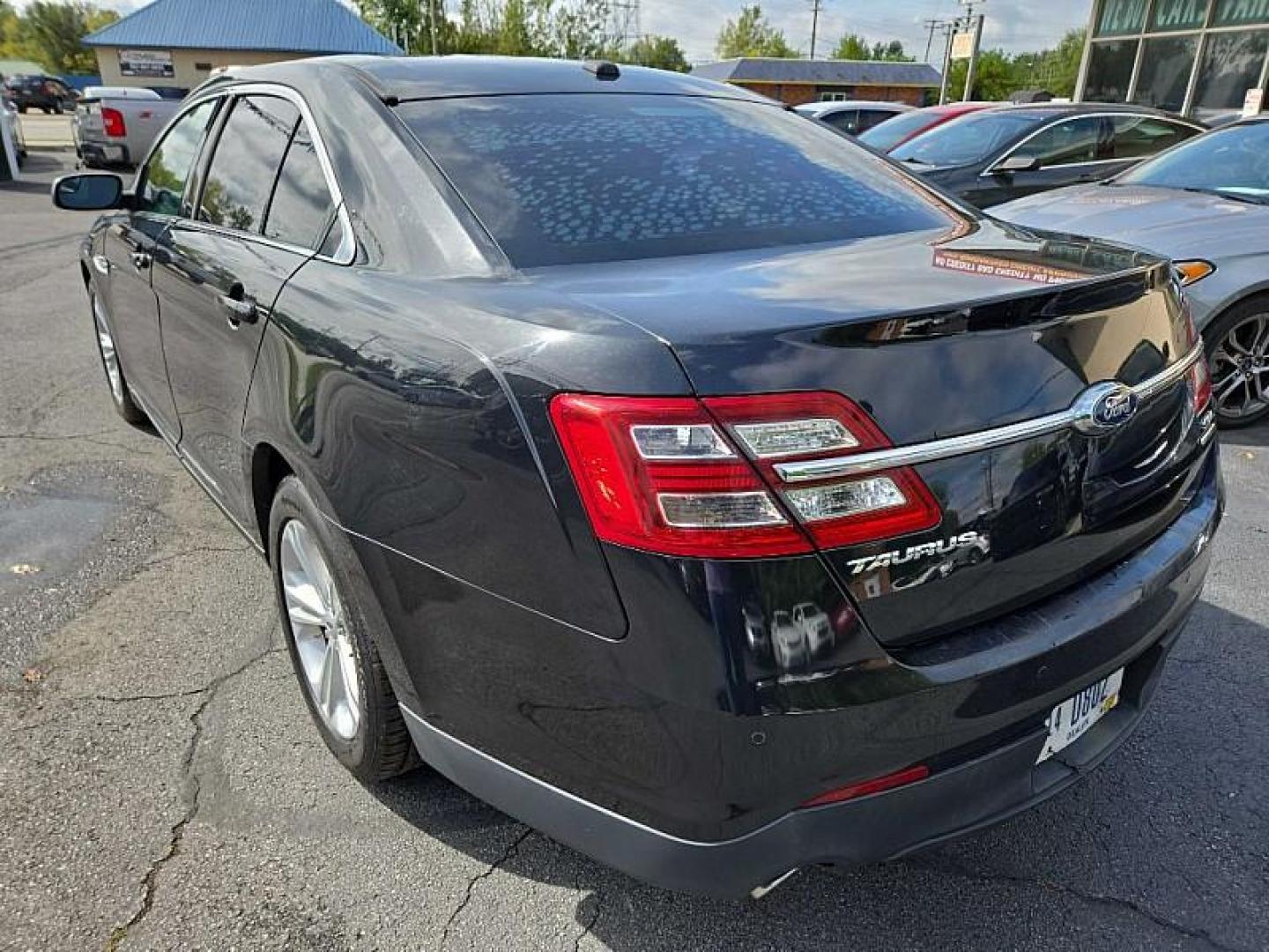 2015 BLACK /BLACK Ford Taurus SEL FWD (1FAHP2E8XFG) with an 3.5L V6 DOHC 24V engine, 6-Speed Automatic transmission, located at 3304 Woodville Road, Northwood, OH, 43619, (419) 210-8019, 41.612694, -83.480743 - We are #1 Auto Loan Dealer for Good Bad or No Credit we have hundreds of vehicles to choose from, stop on in or just fill out our online application to get approved for auto financing and see your credit score for free by visiting our website today. We have Low Payment Options and Terms Available - Photo#2